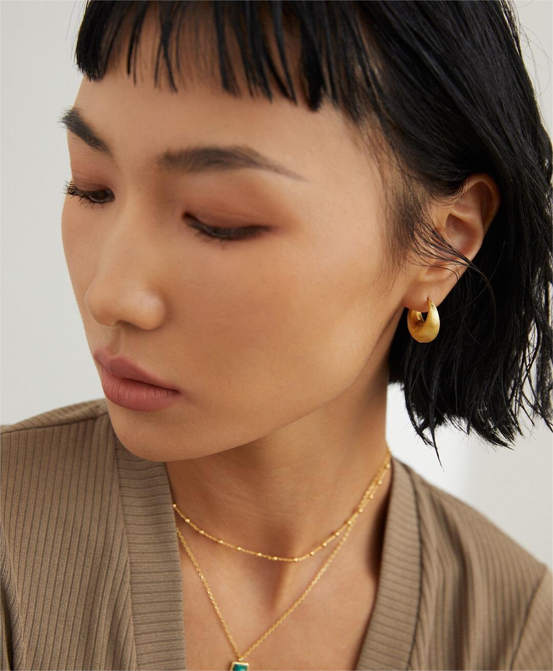 A delicate Minimalist Ball Chain Necklace featuring gold vermeil and silver beads, elegantly displayed on a soft background.