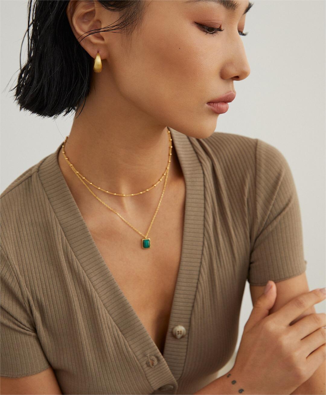 A delicate Minimalist Ball Chain Necklace featuring gold vermeil and silver beads, elegantly displayed on a soft background.