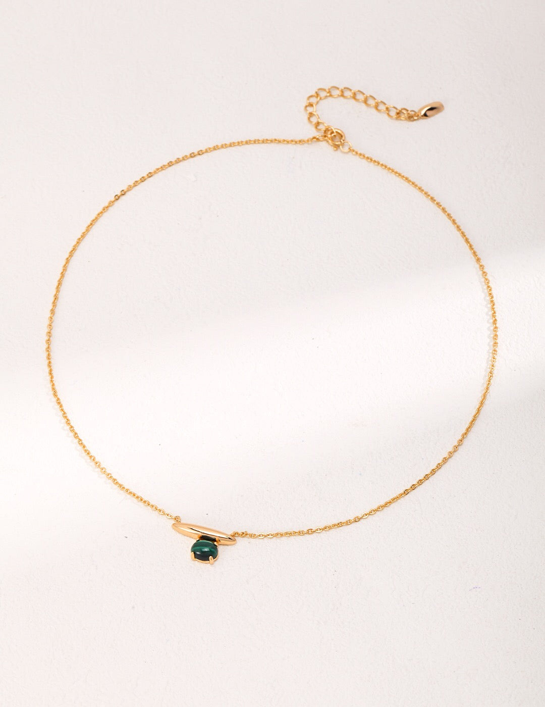 A beautiful Minimalist Lapis Lazuli and Malachite Necklace featuring a gold vermeil chain, showcasing vibrant blue and green stones.