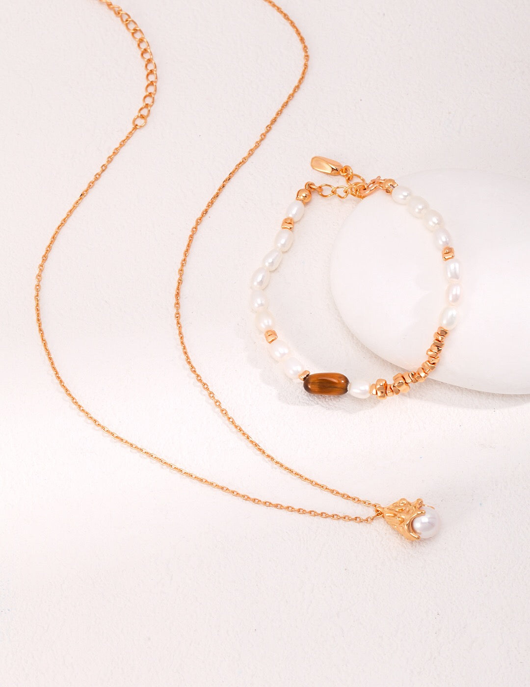 A beautiful Minimalist Lustrous Pearl Necklace featuring natural pearls, sterling silver, and gold vermeil, elegantly displayed on a soft background.