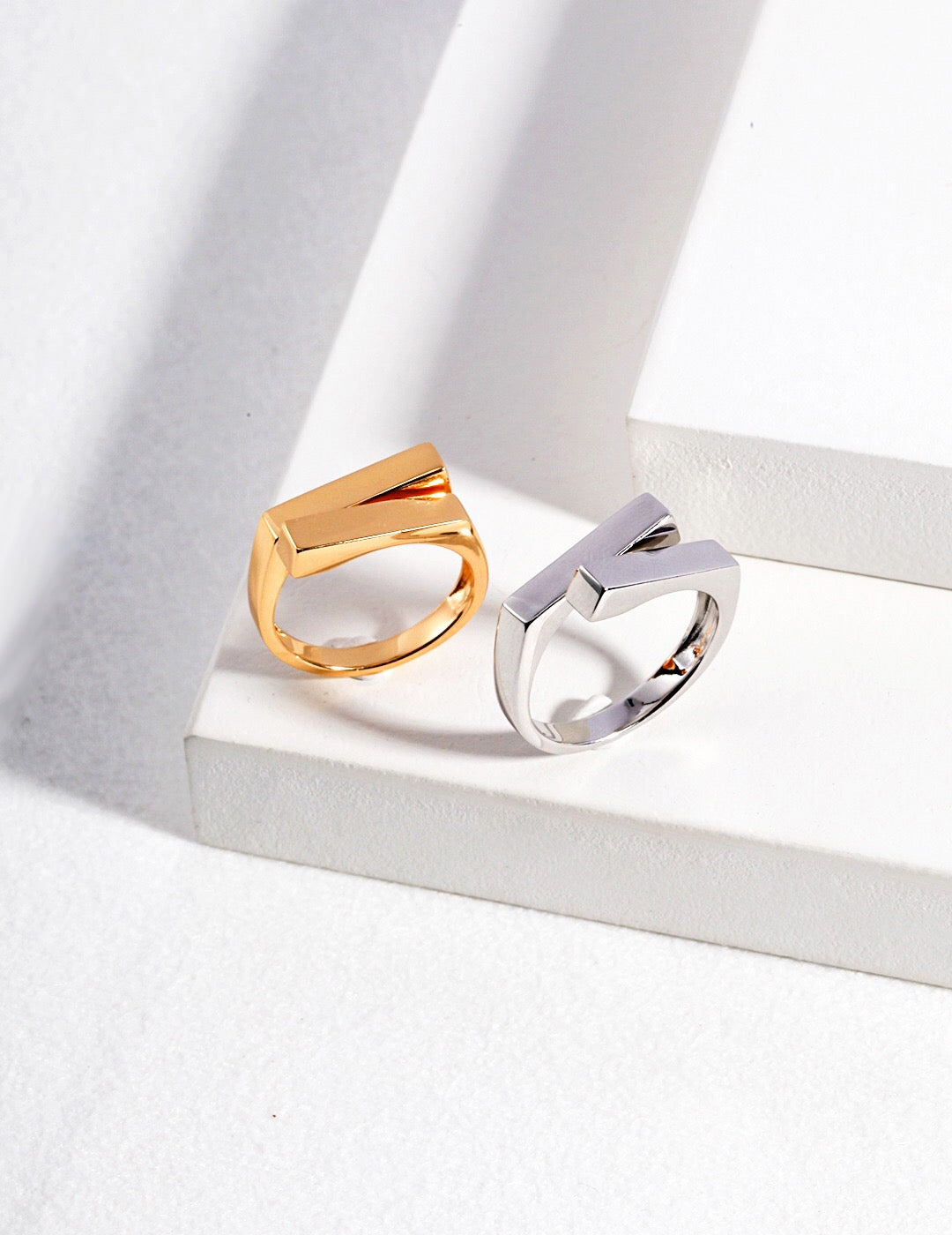 A close-up of a Minimalist Modern Stacking Ring made of gold vermeil, showcasing its sleek design and adjustable size.