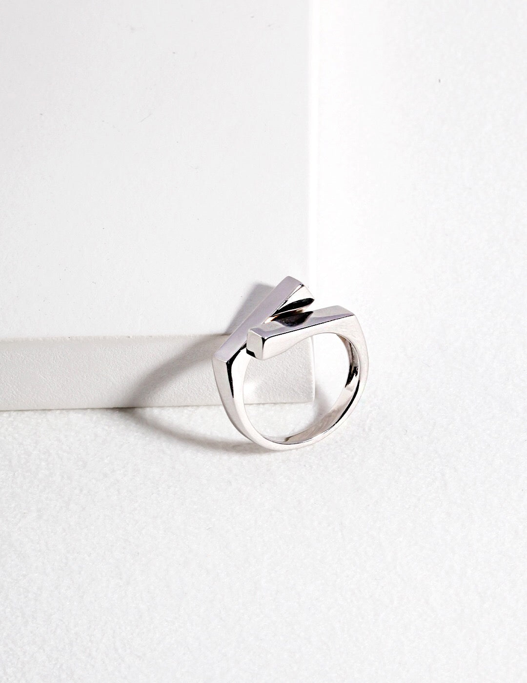 A close-up of a Minimalist Modern Stacking Ring made of gold vermeil, showcasing its sleek design and adjustable size.