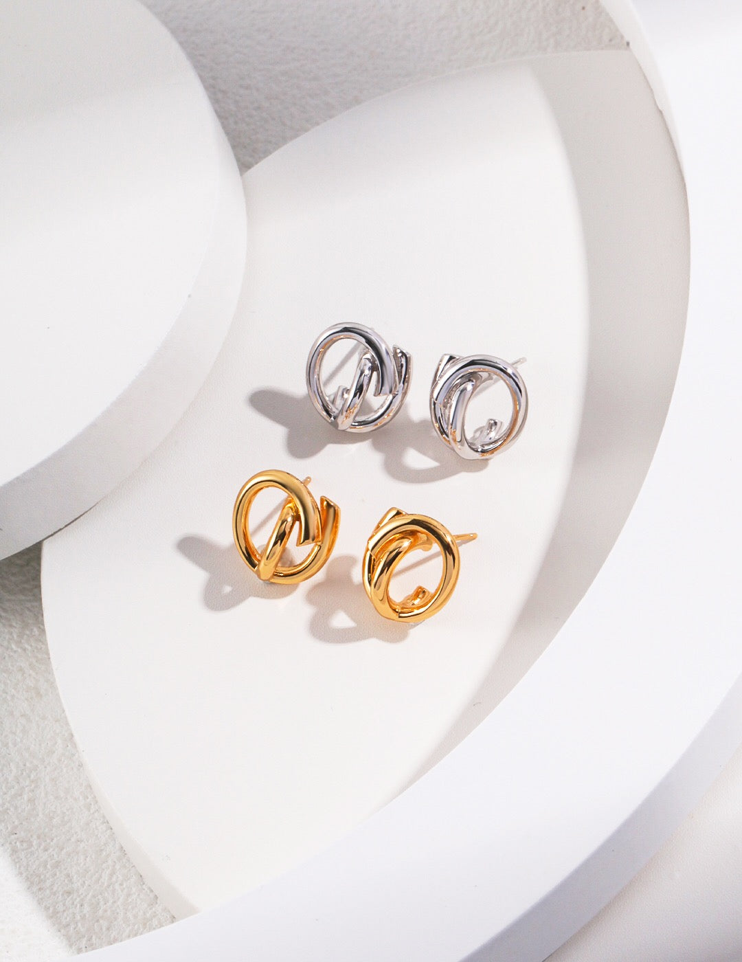 A pair of elegant Minimalist Style Stud Earrings made of gold vermeil, showcasing a simple yet chic design.