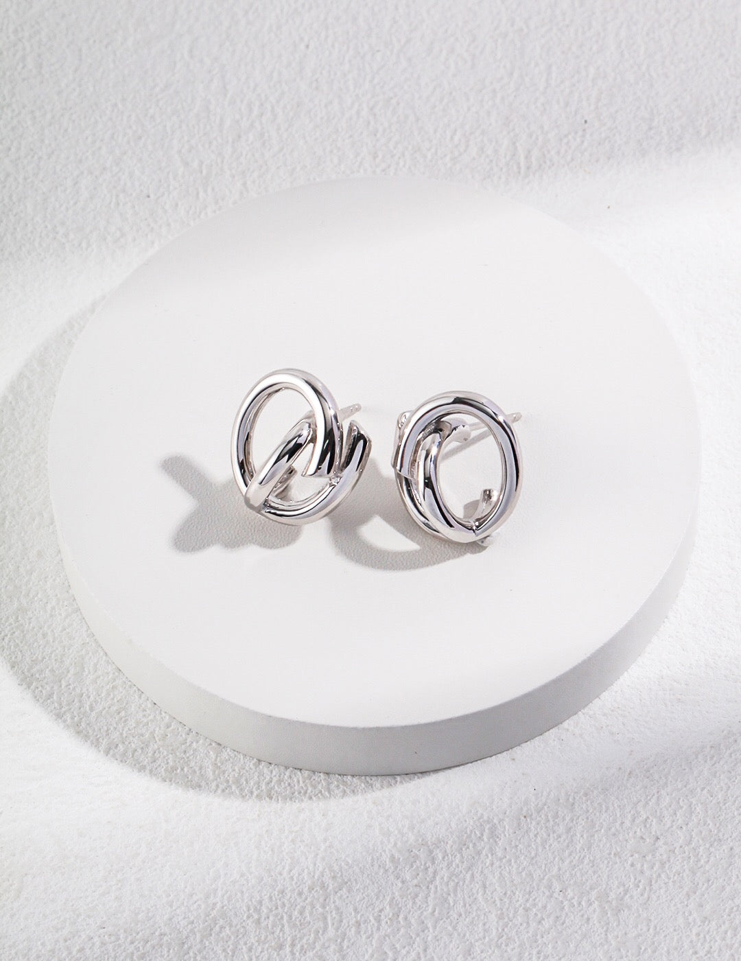 A pair of elegant Minimalist Style Stud Earrings made of gold vermeil, showcasing a simple yet chic design.