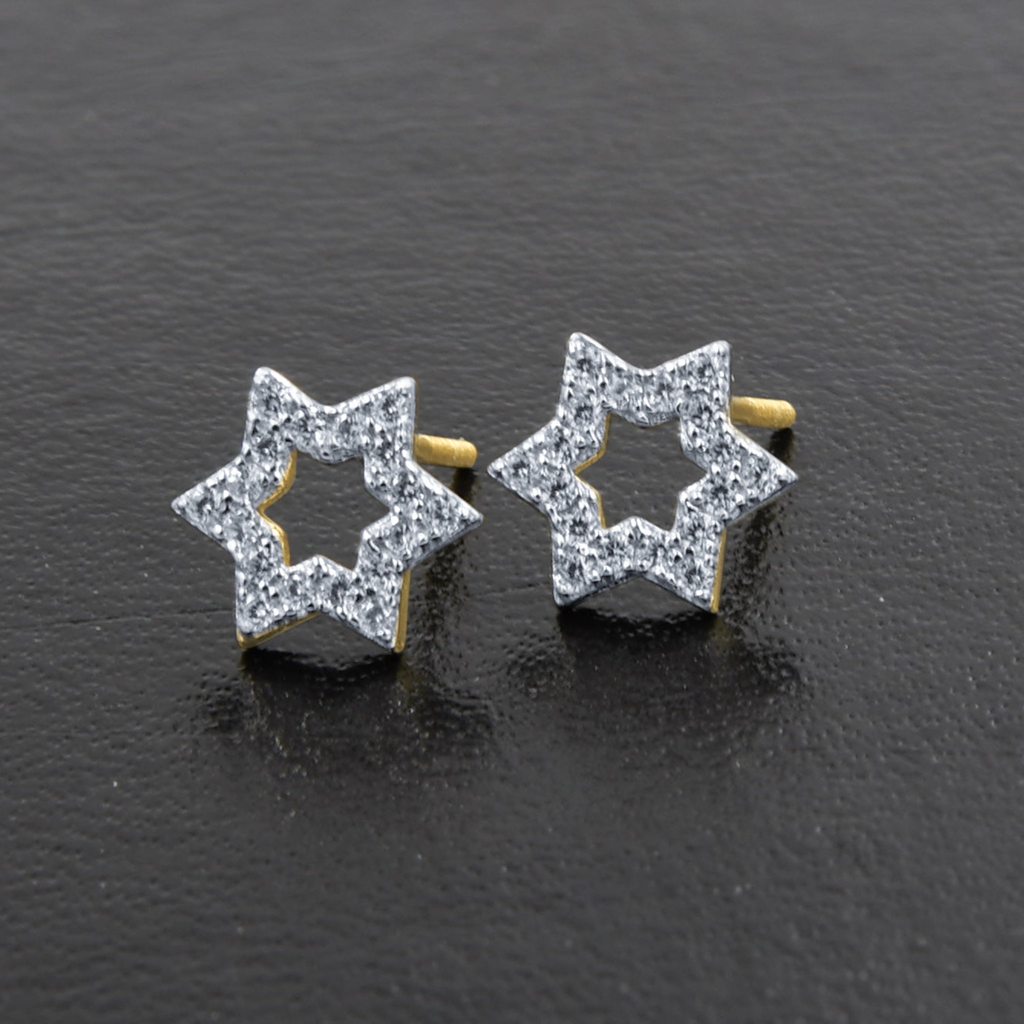 A pair of Miraculous Star Earrings made from 925 sterling silver, featuring sparkling cubic zircon stones in a unique star design.