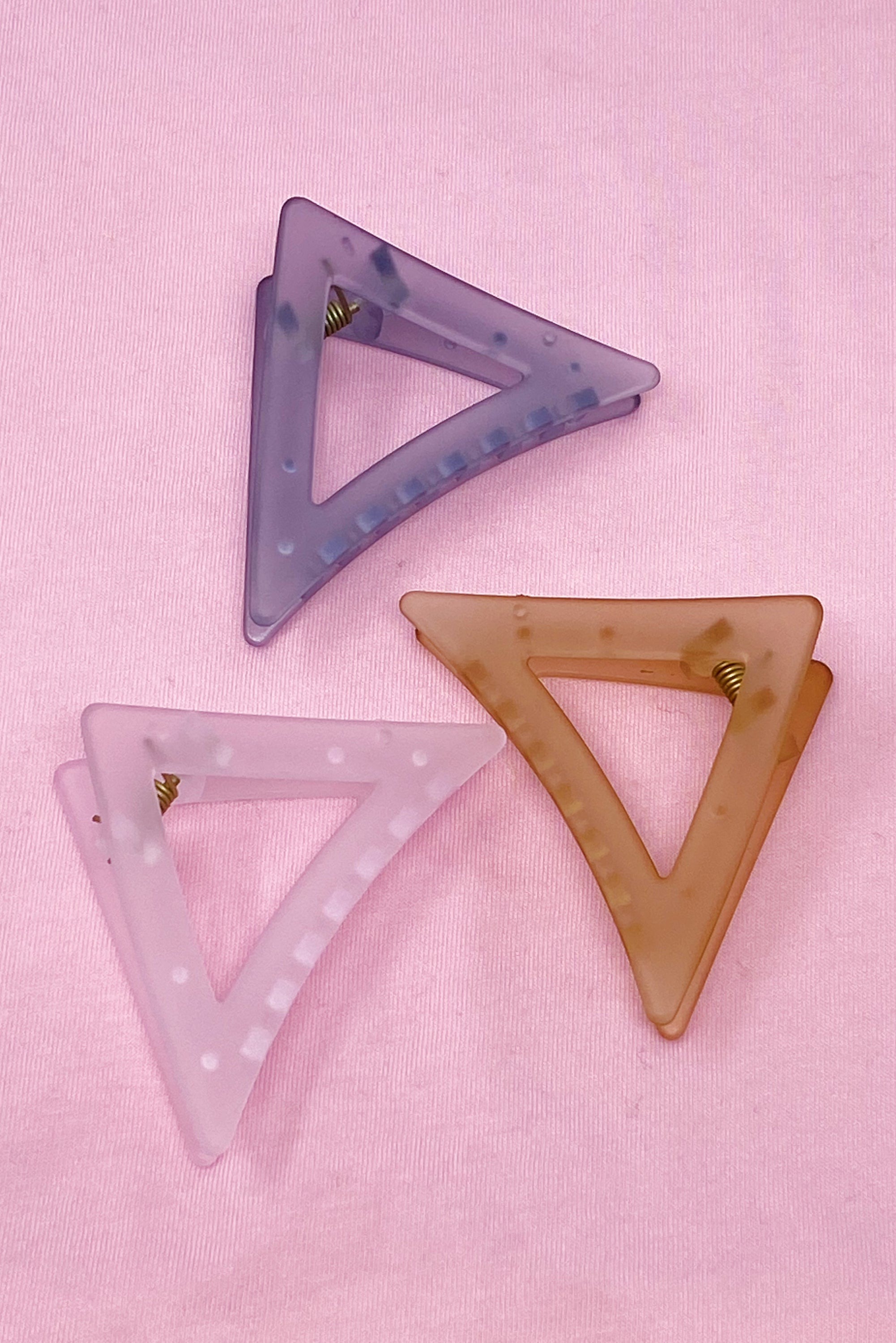 Mistic Splash Hair Claw in triangle shape, sleek acrylic design, perfect for half-up hairstyles.