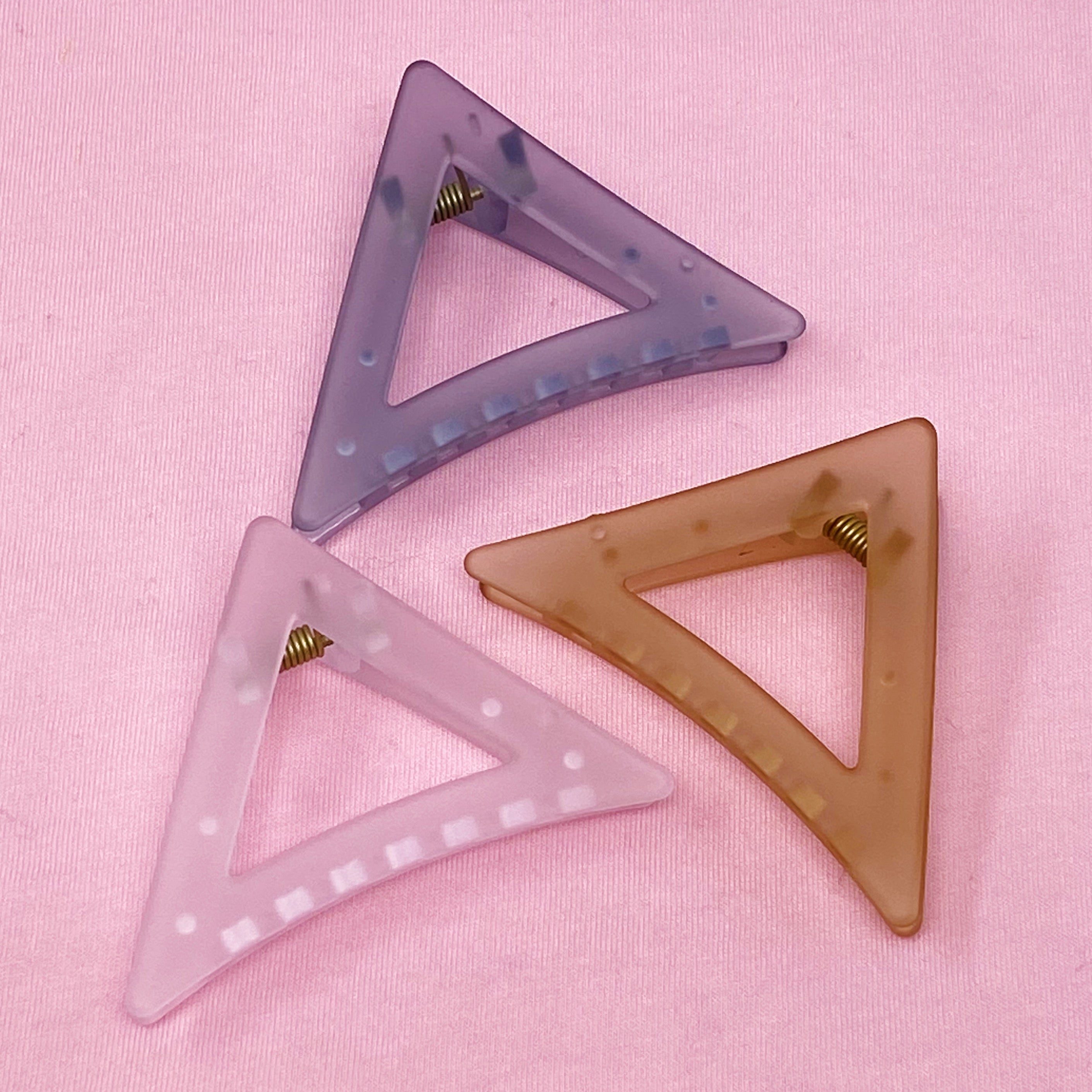 Mistic Splash Hair Claw in triangle shape, sleek acrylic design, perfect for half-up hairstyles.