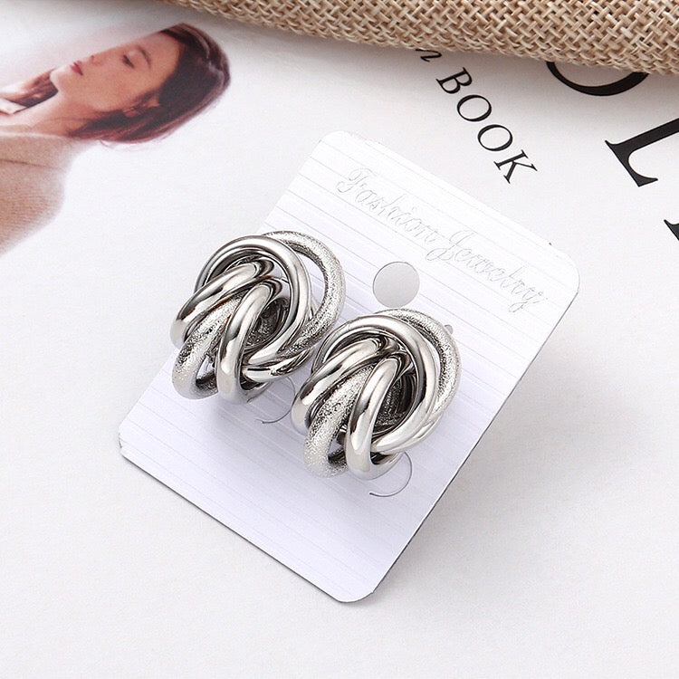 A pair of stylish mix glaze and matte multi hoop earrings made from alloy and steel, showcasing a modern design.