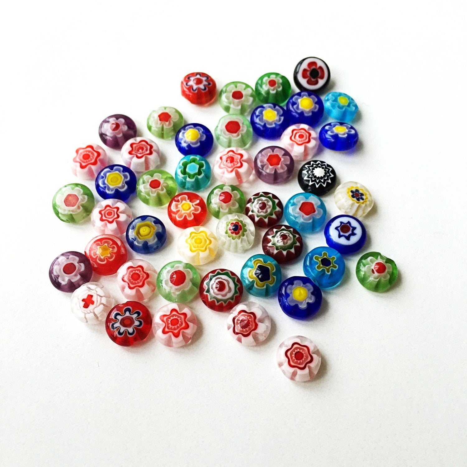 A vibrant assortment of mixed color evil eye glass beads, showcasing 120 pieces in 8mm and 10mm sizes with intricate millefiori designs.