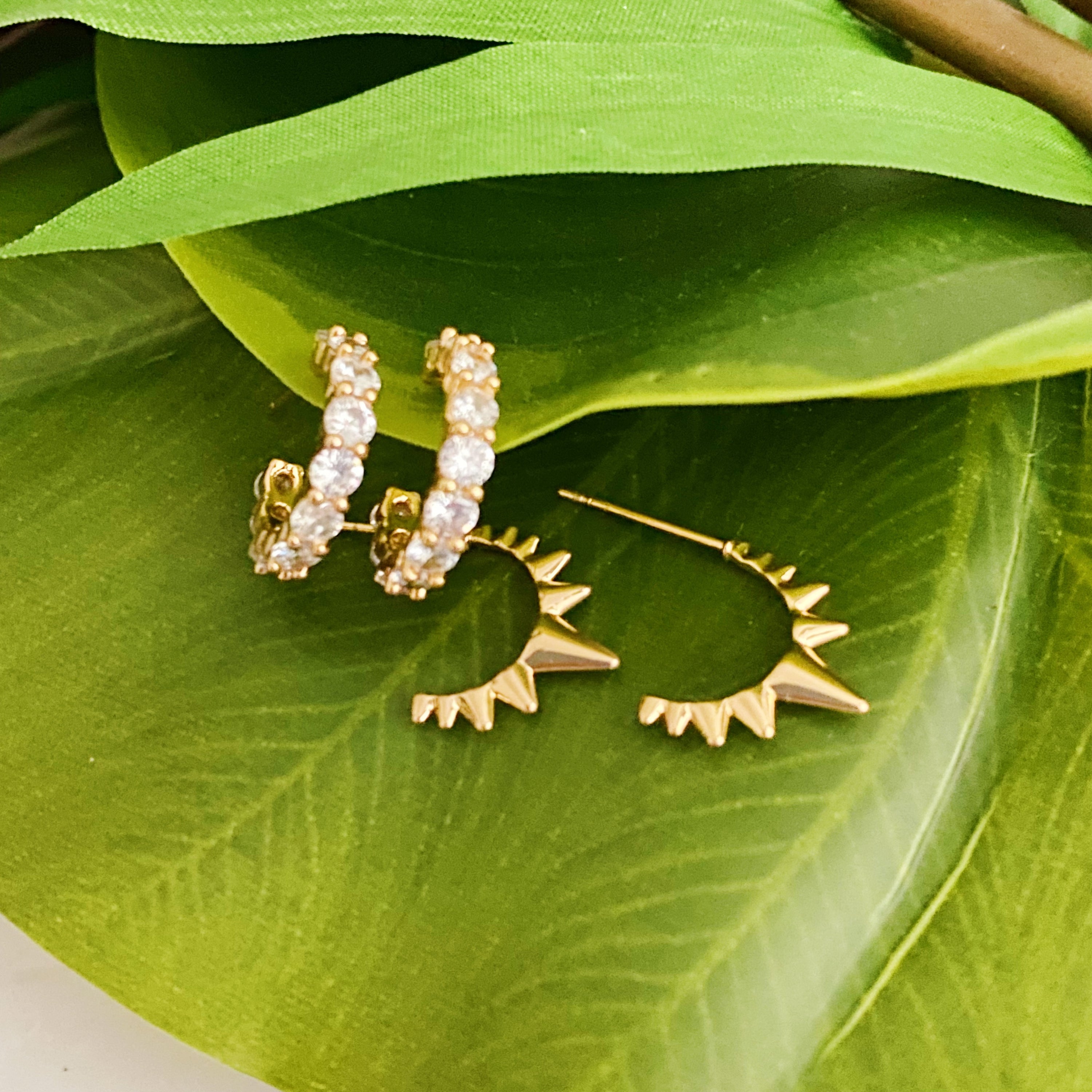 Mood Changer Mini Hoop Earring Set featuring two pairs of earrings, one with sparkly design and the other with edgy spiky details, in 18k gold plating.