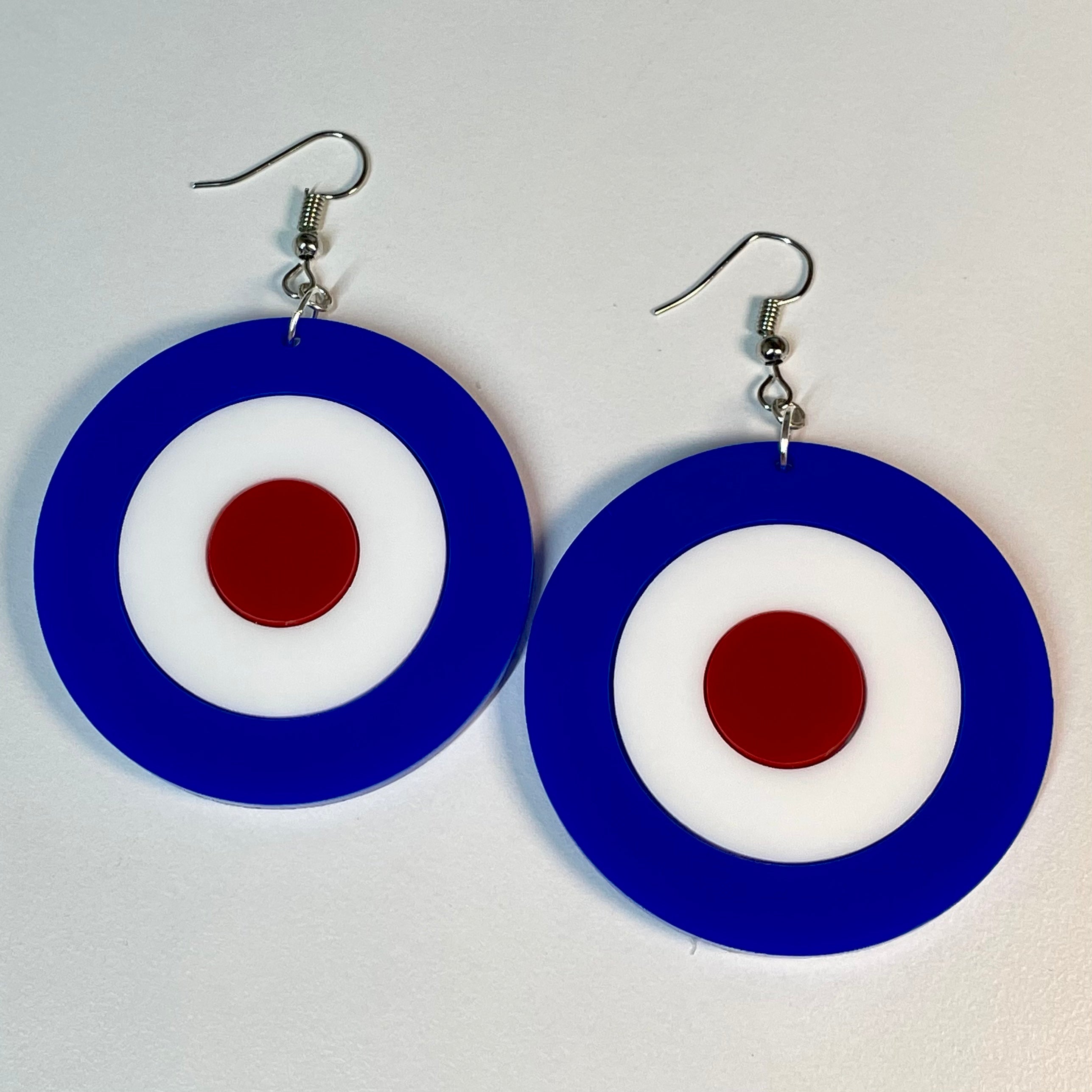 A pair of stylish Mod Target Earrings featuring laser-cut acrylic in a vibrant design, available in silver or gold finishes.