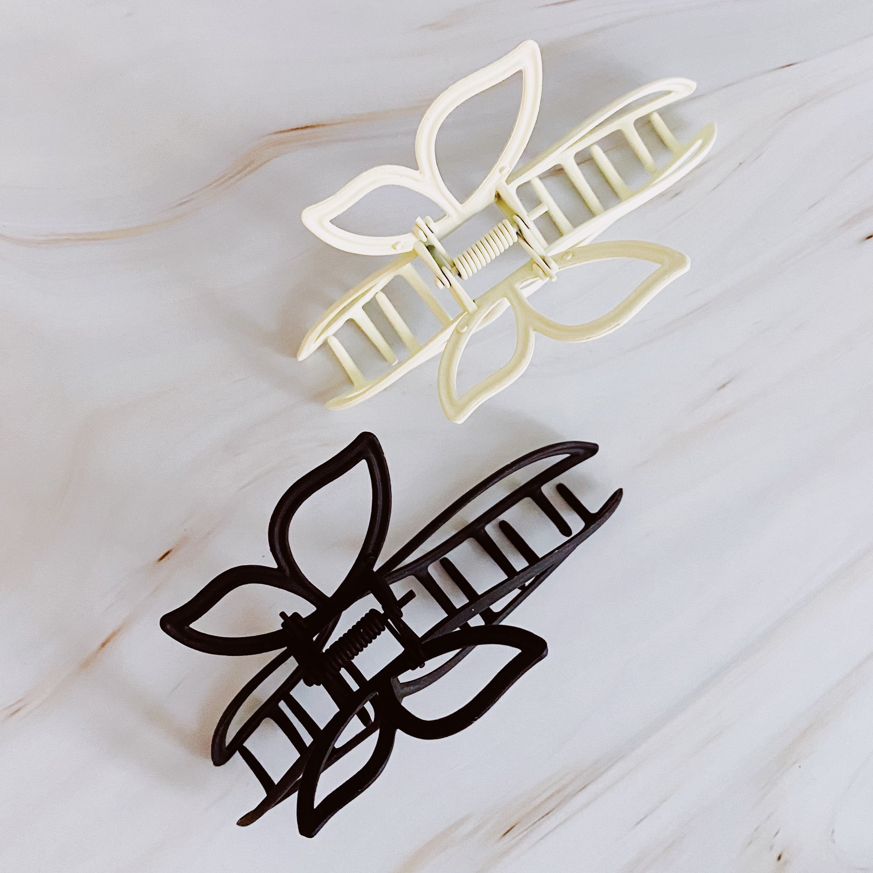 Modern Butterfly Hair Claw Set of 2 featuring elegant design and sturdy construction, ideal for securing hair stylishly.