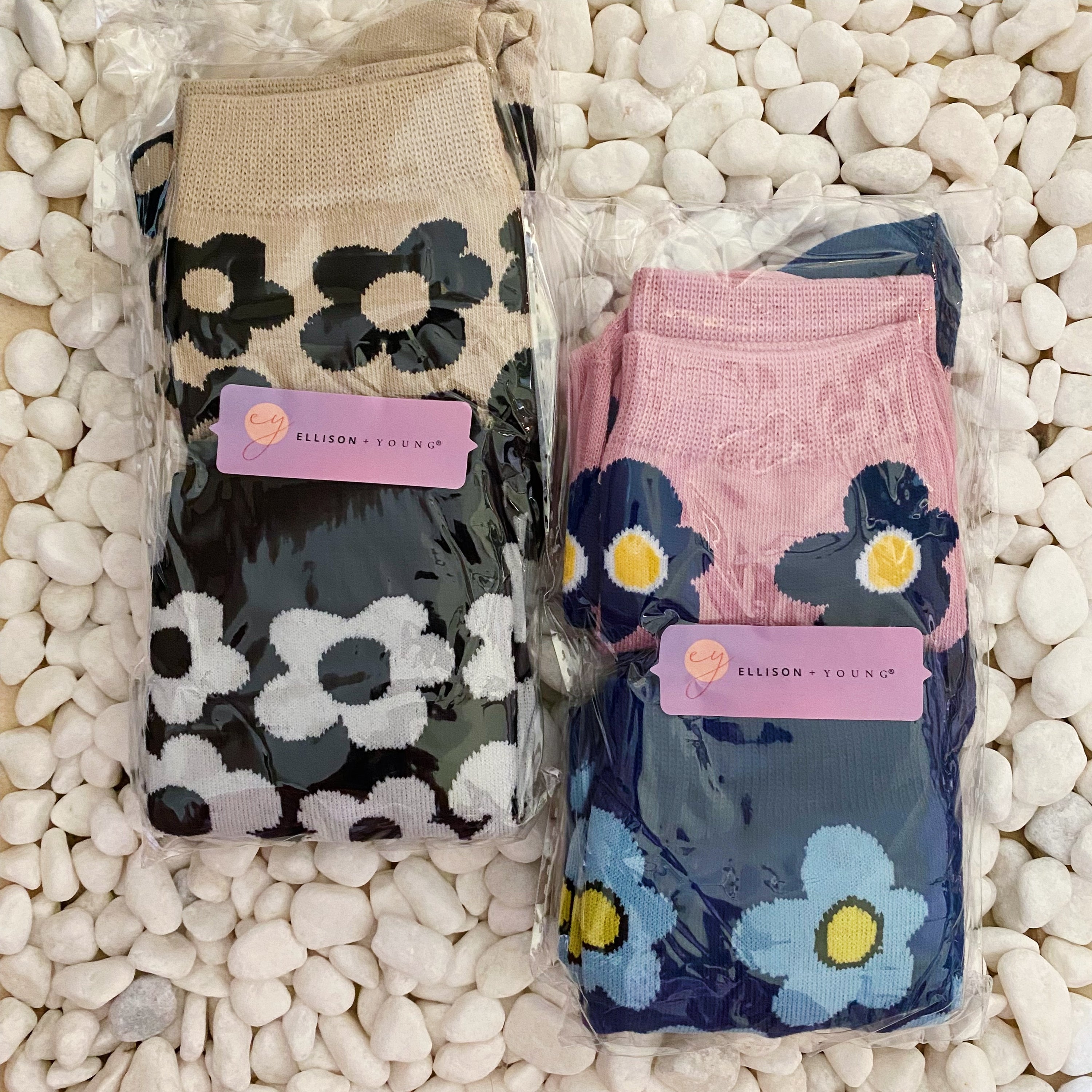 A set of two pairs of modern daisy socks featuring a unique daisy pattern in soft, stretchy material, perfect for comfortable wear.