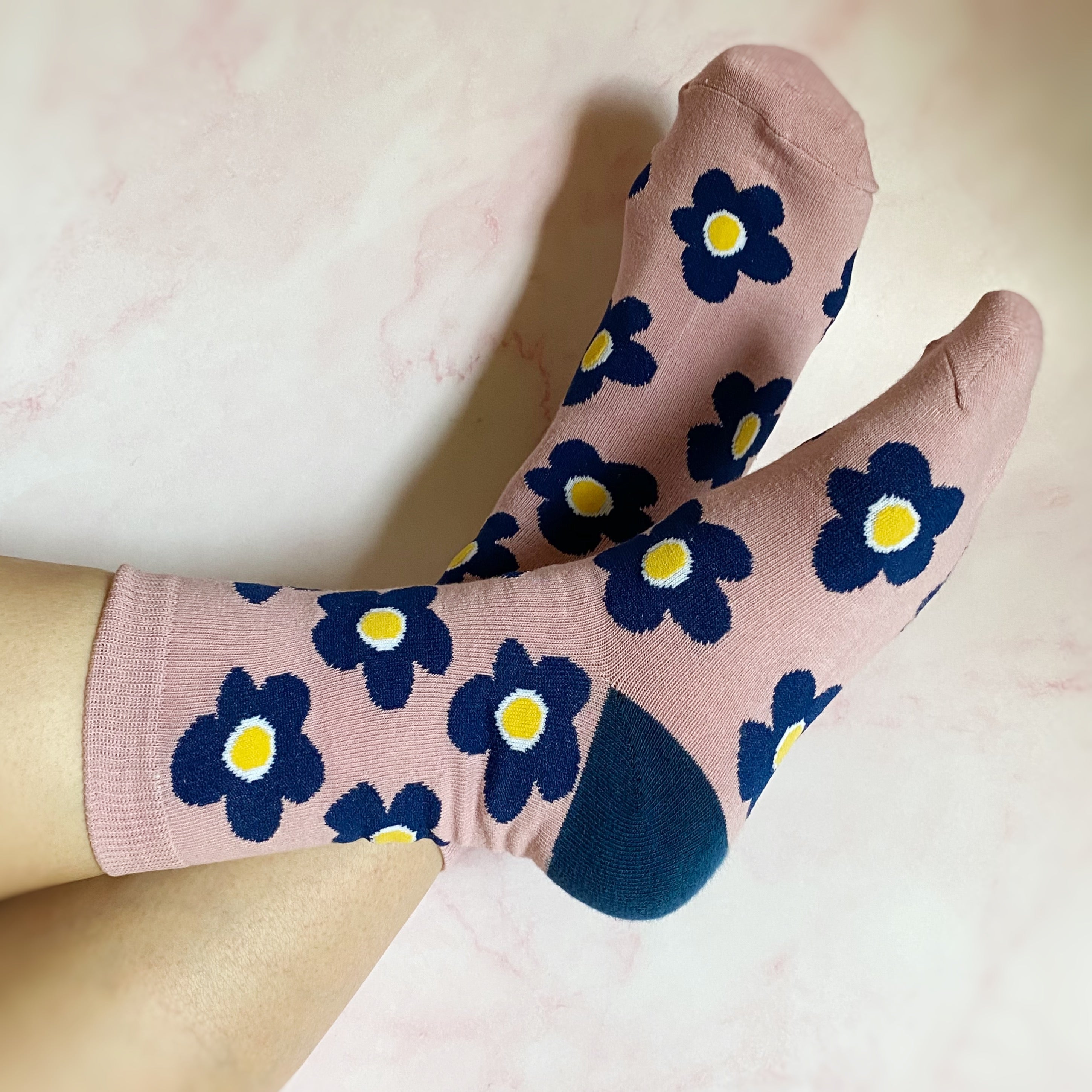 A set of two pairs of modern daisy socks featuring a unique daisy pattern in soft, stretchy material, perfect for comfortable wear.