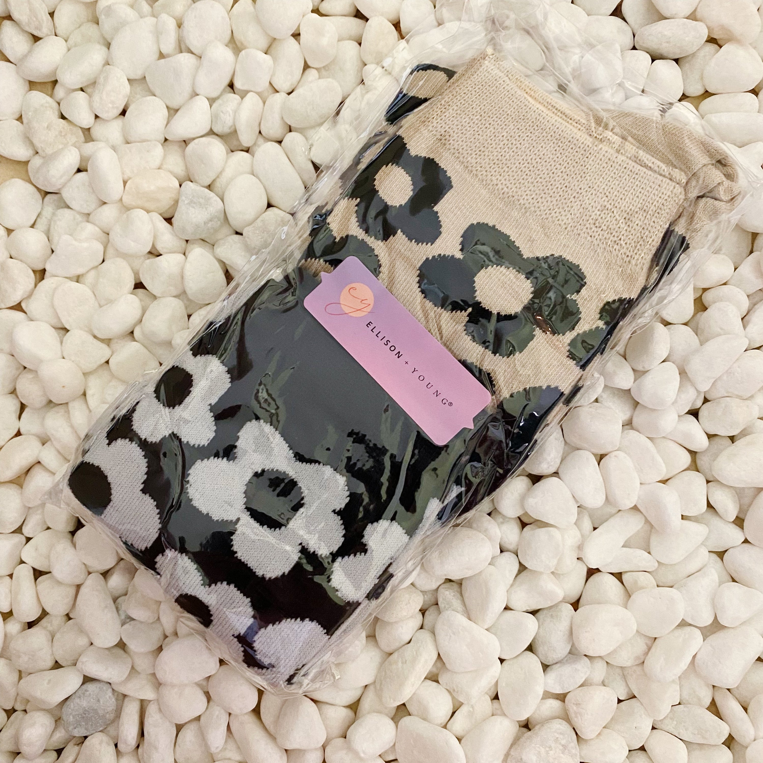 A set of two pairs of modern daisy socks featuring a unique daisy pattern in soft, stretchy material, perfect for comfortable wear.