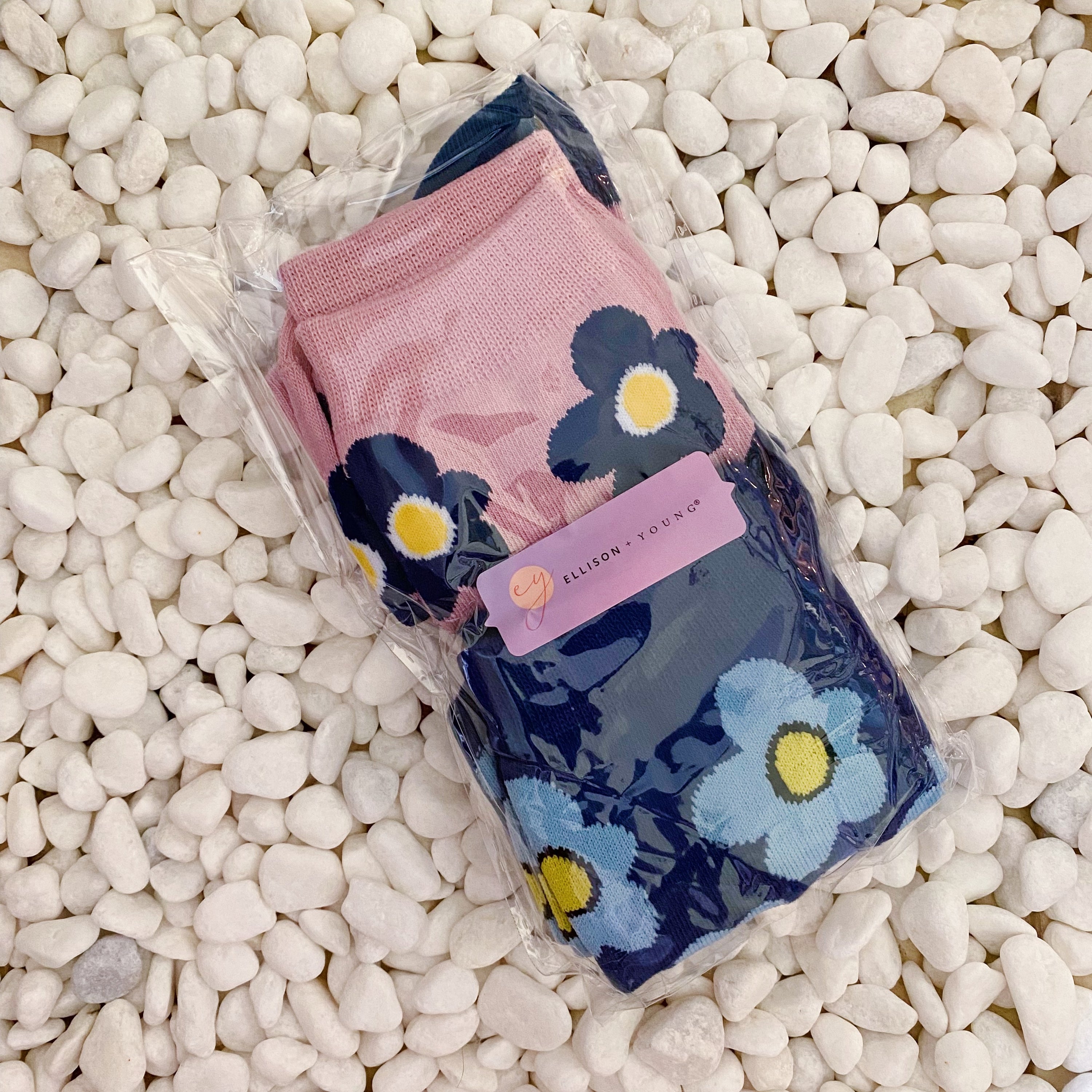 A set of two pairs of modern daisy socks featuring a unique daisy pattern in soft, stretchy material, perfect for comfortable wear.