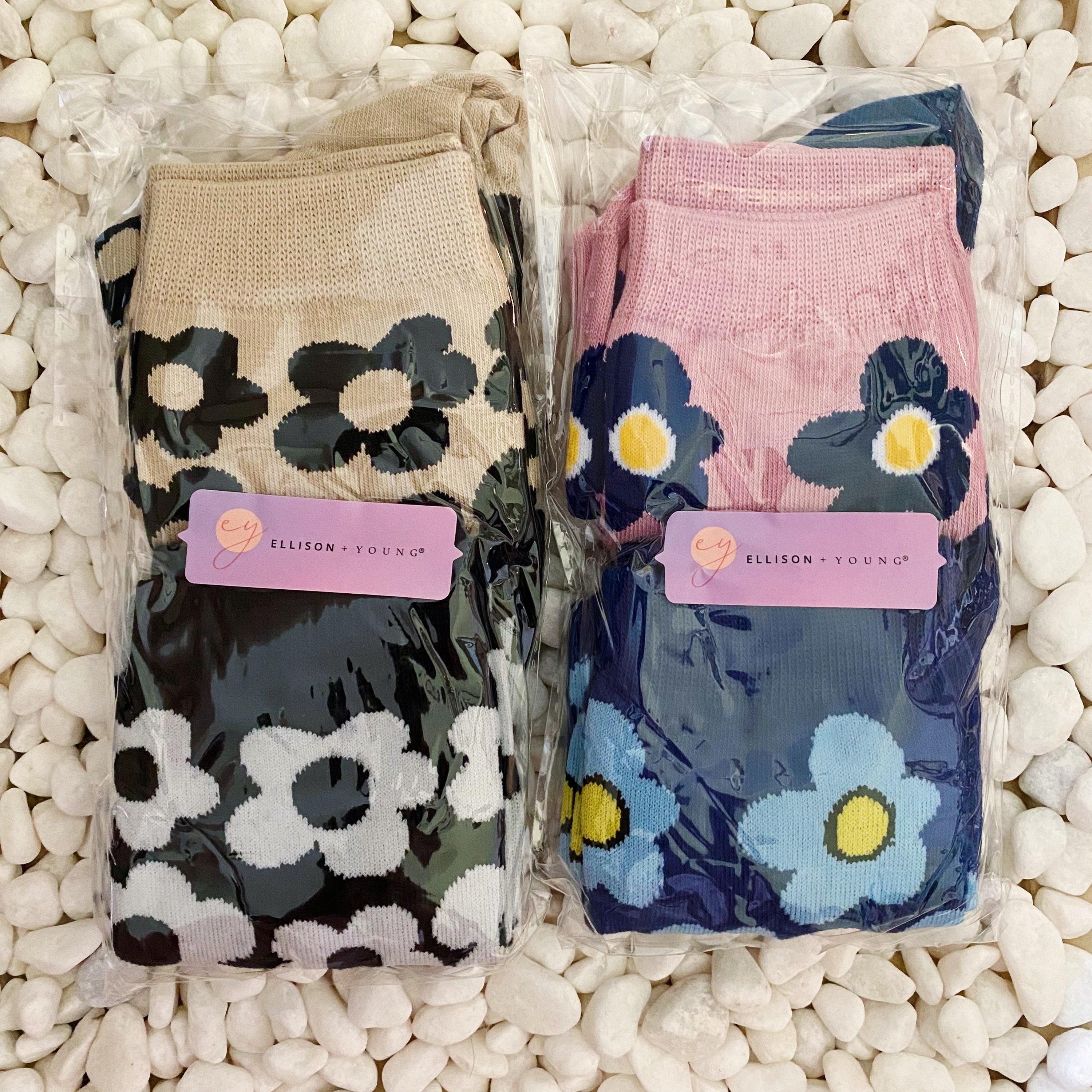 A set of two pairs of modern daisy socks featuring a unique daisy pattern in soft, stretchy material, perfect for comfortable wear.