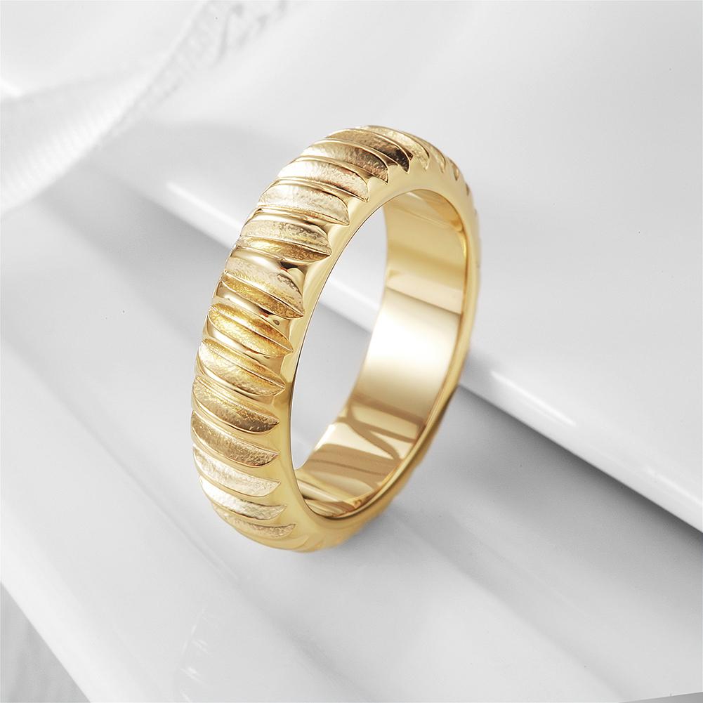 A stylish Modern Ribbed Ring made of 316L surgical stainless steel with 14K gold PVD plating, showcasing a contemporary ribbed design.