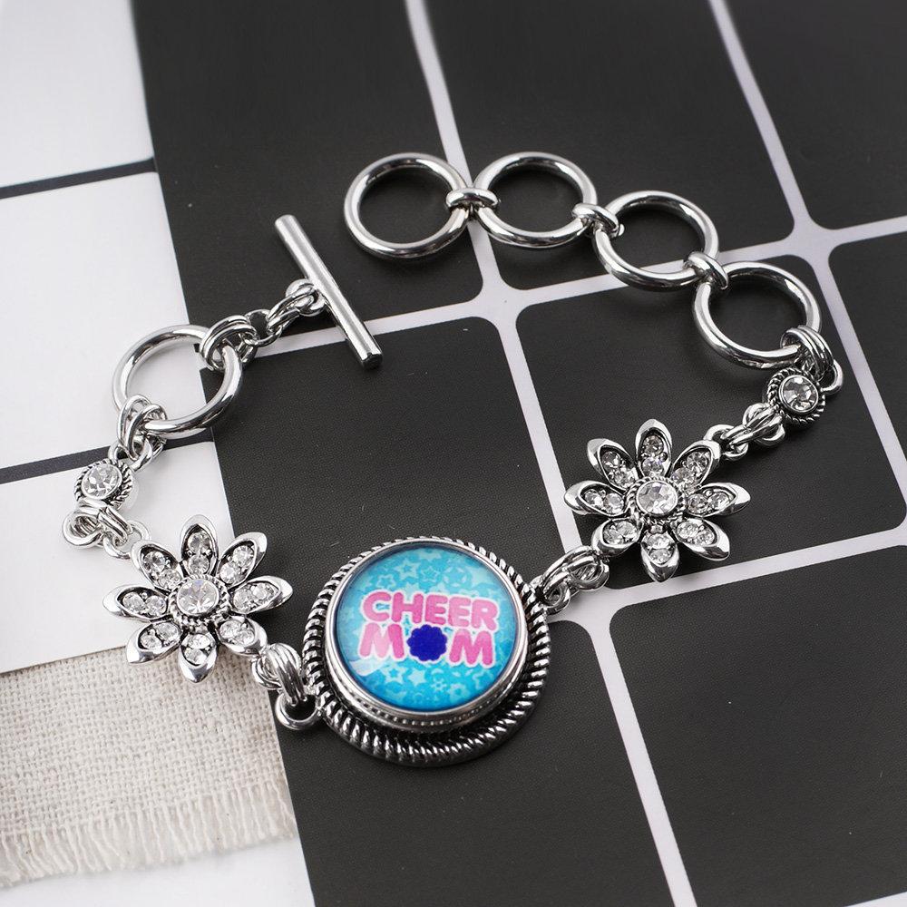 Cheer Mom Snap, a hand-pressed 7/8” round snap featuring vibrant cheer-themed design, perfect for jewelry accessories.