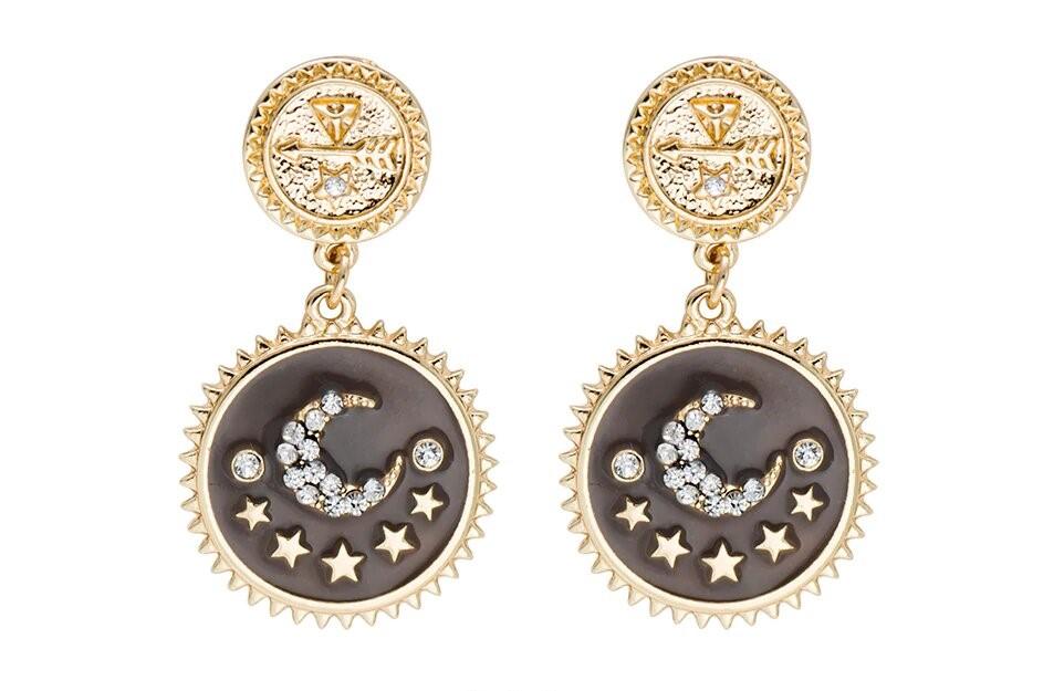 Elegant gold plated moon and star dangle earrings, showcasing intricate design and lightweight structure.