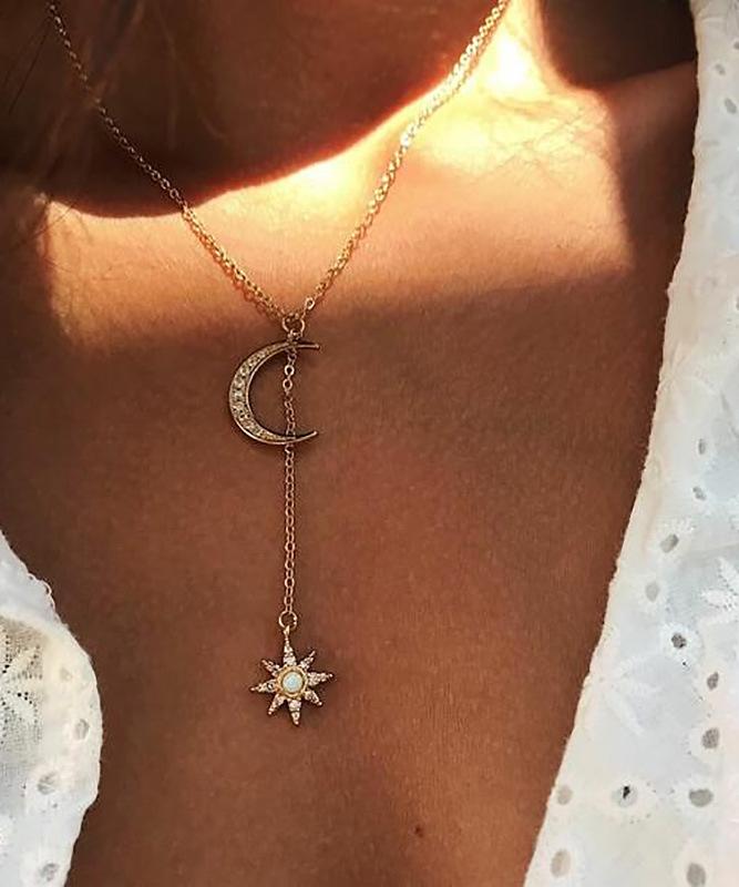 Elegant Moon and Star Necklace featuring Austrian Crystals, crafted in 18K gold plating, showcasing a beautiful celestial design.