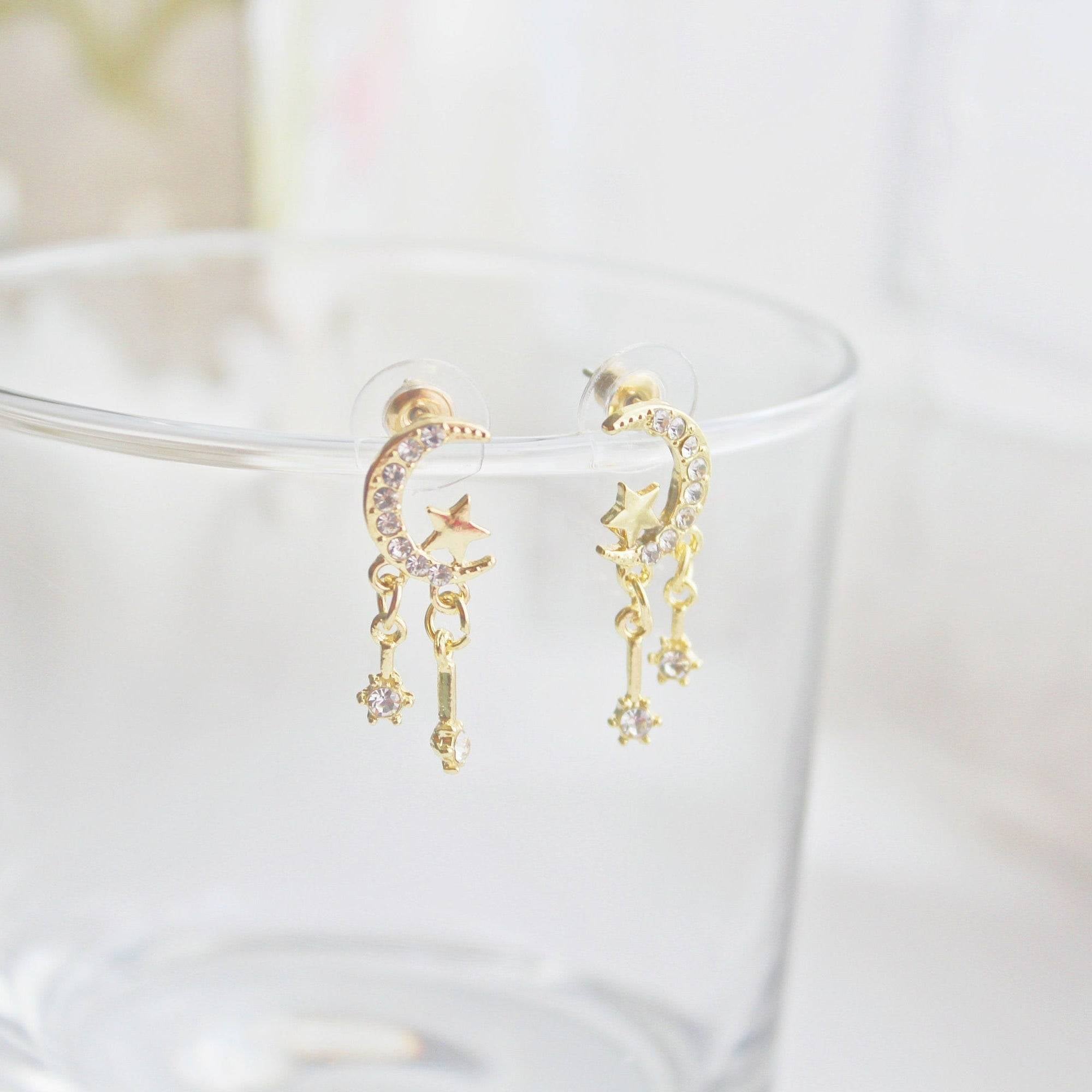 Moon and Stars Mini Crystal Drop Sterling Silver Stud Earrings featuring a crescent moon and shooting stars design, crafted from sterling silver and gold plated bronze.