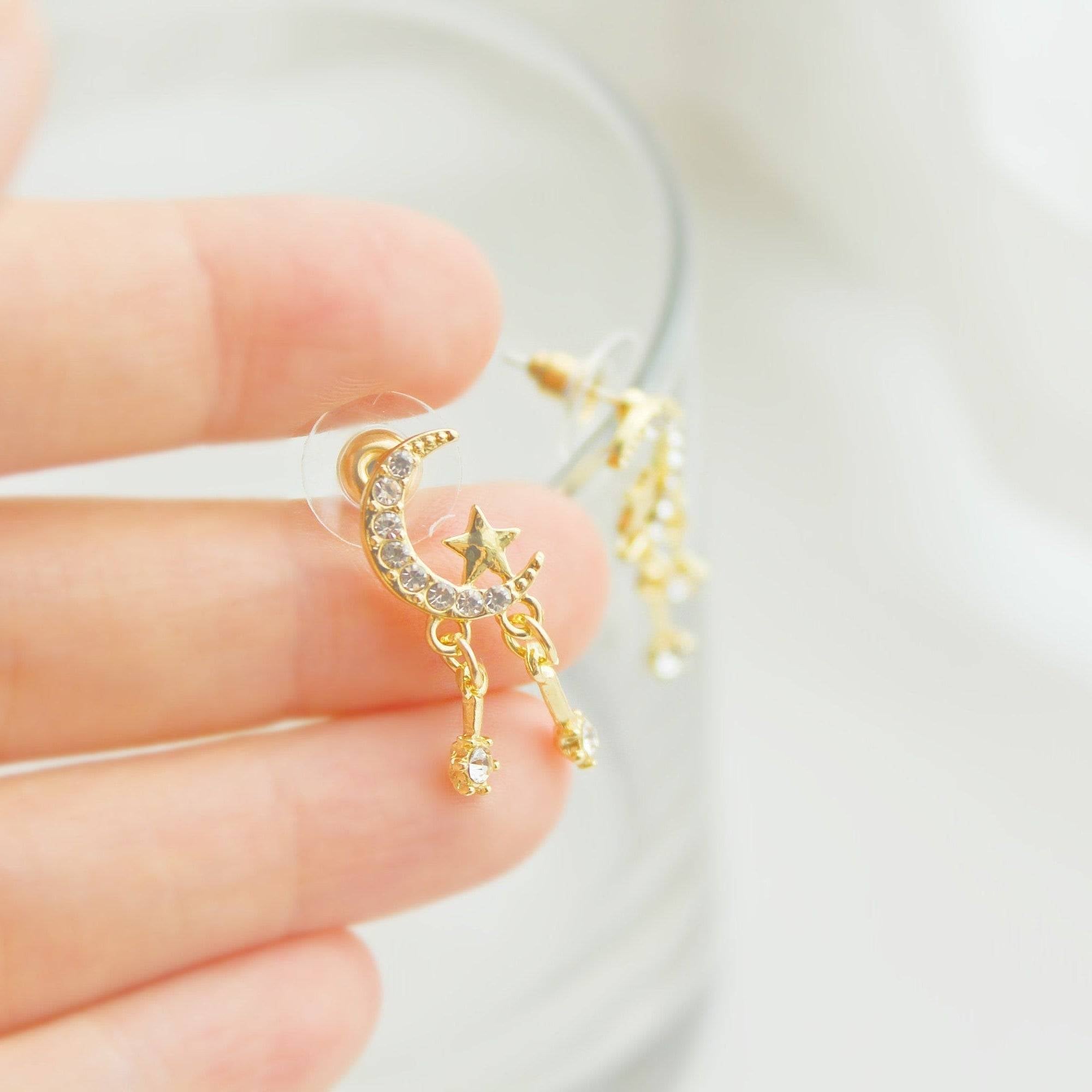 Moon and Stars Mini Crystal Drop Sterling Silver Stud Earrings featuring a crescent moon and shooting stars design, crafted from sterling silver and gold plated bronze.