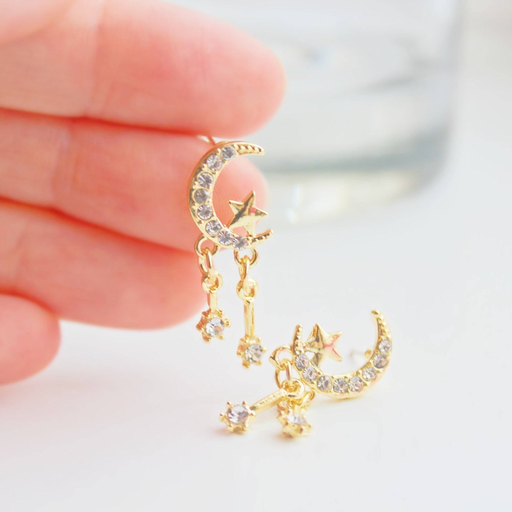 Moon and Stars Mini Crystal Drop Sterling Silver Stud Earrings featuring a crescent moon and shooting stars design, crafted from sterling silver and gold plated bronze.