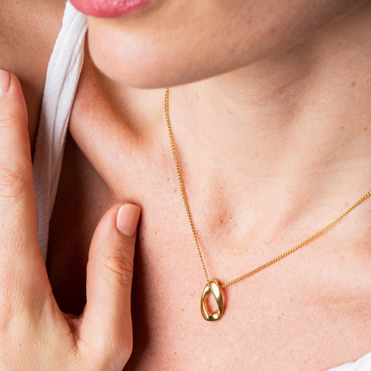 Mona Pyroni Pendant Necklace in gold, showcasing its elegant design and premium craftsmanship.