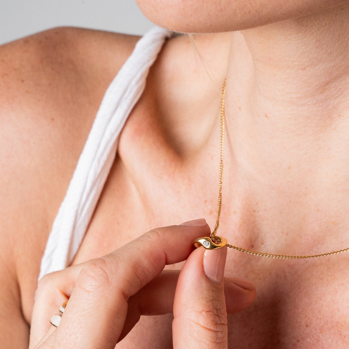 Mona Pyroni Pendant Necklace in gold, showcasing its elegant design and premium craftsmanship.