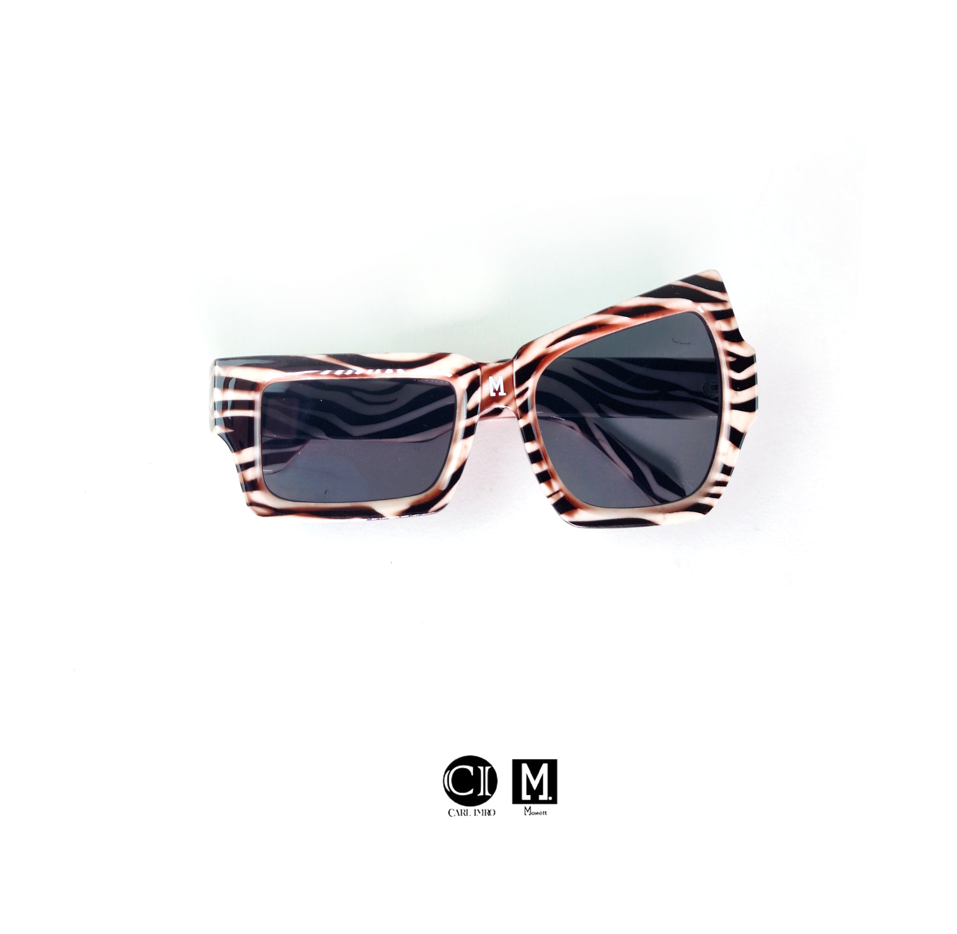 Monett Manifesto BoltB sunglasses with square frames, plastic lenses, and stylish design, perfect for outdoor activities.