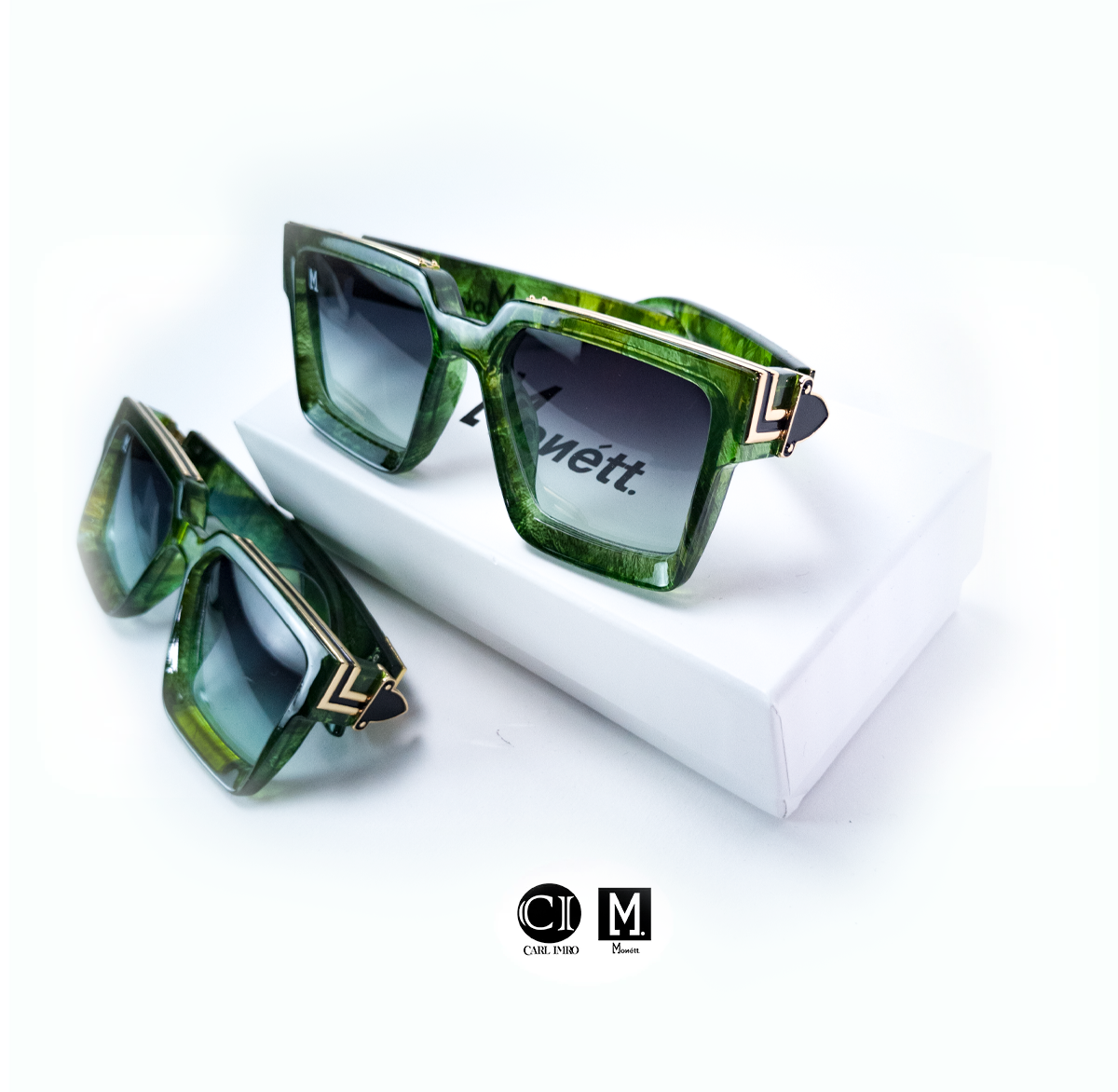 Green square sunglasses on box.