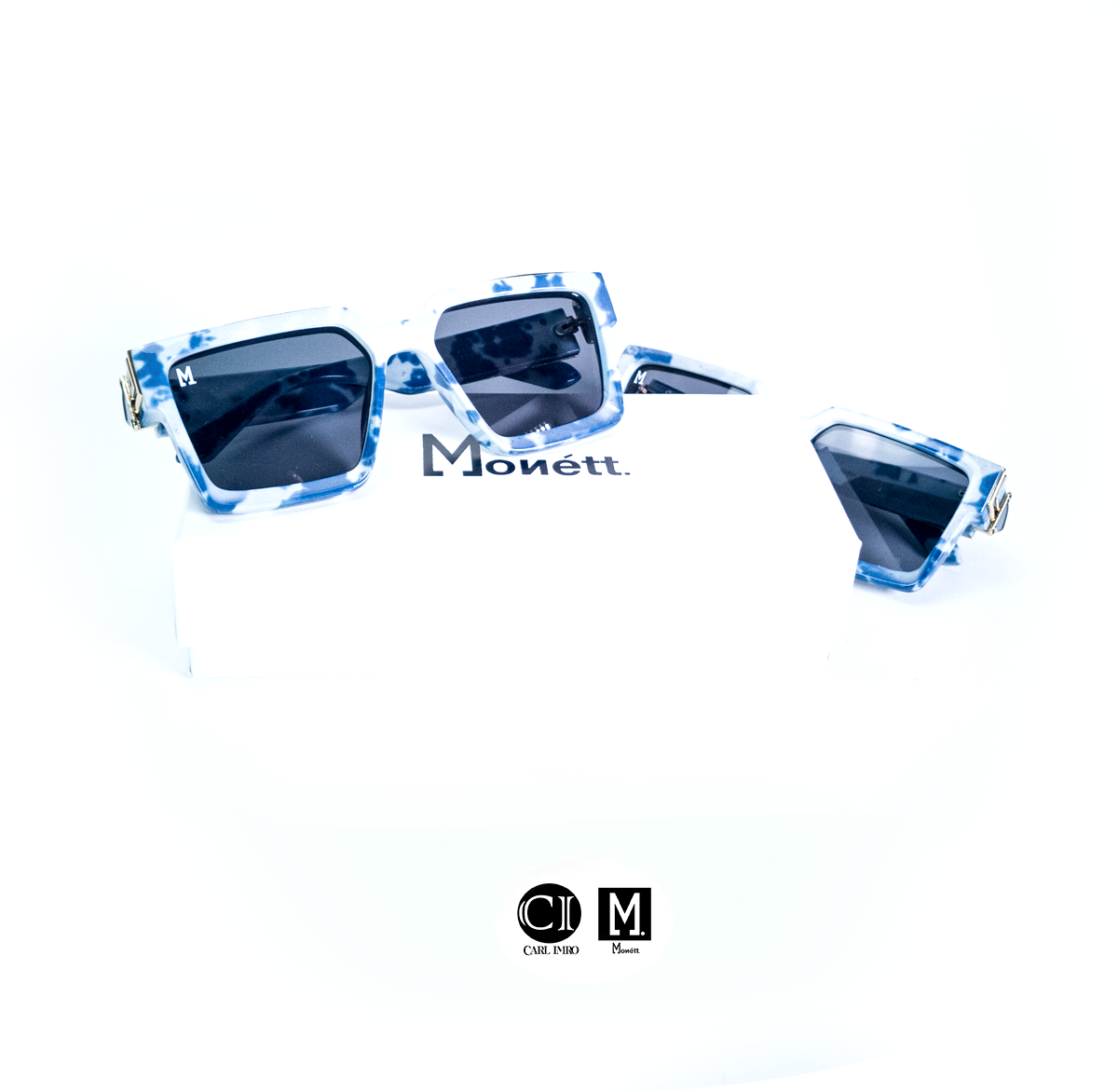 Monett Manifesto MarBlu sunglasses featuring a stylish square frame, lightweight plastic lenses, and a signature box.