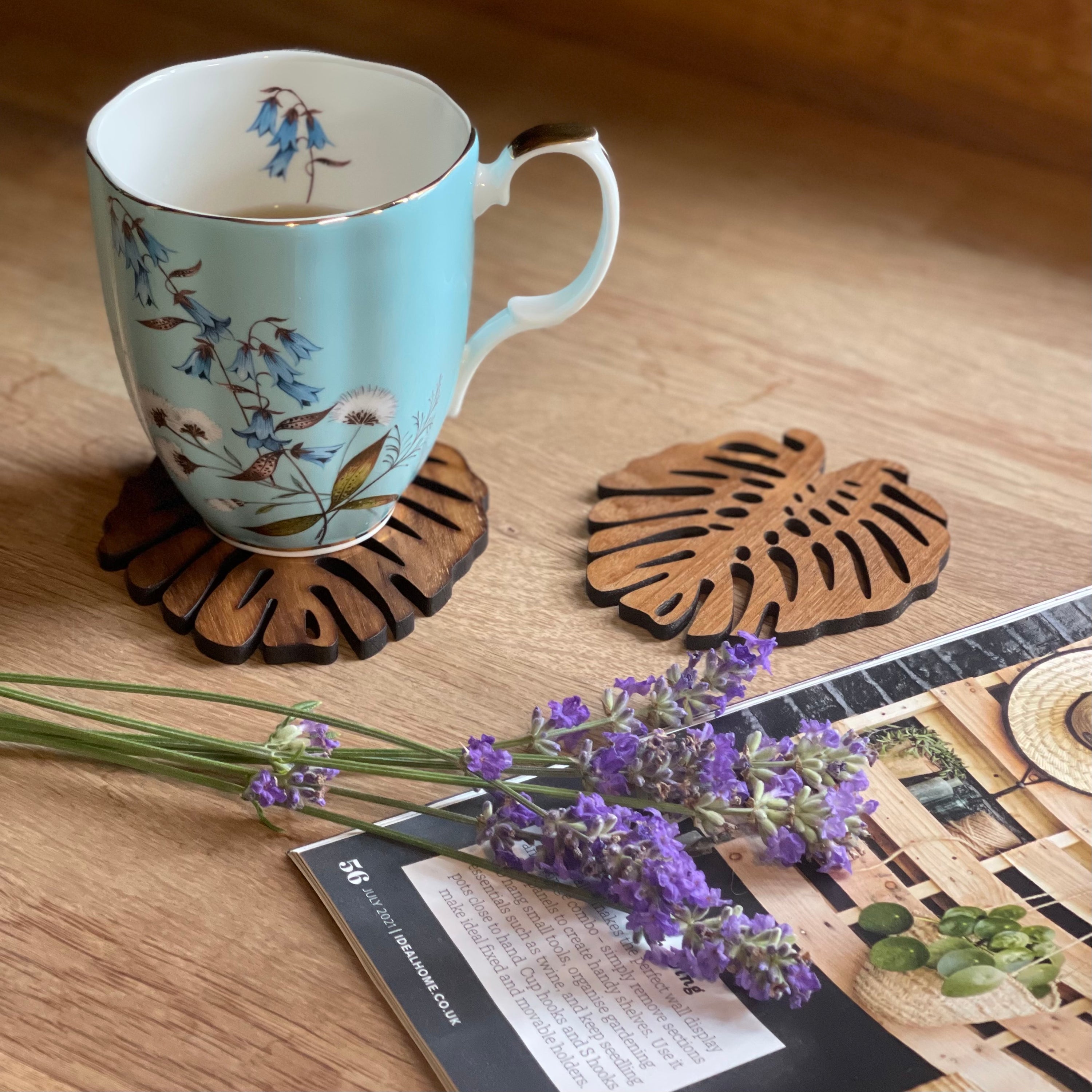 Set of 2 or 4 Monstera Upcycled Teak Wood Coasters, showcasing unique designs and natural wood grain.