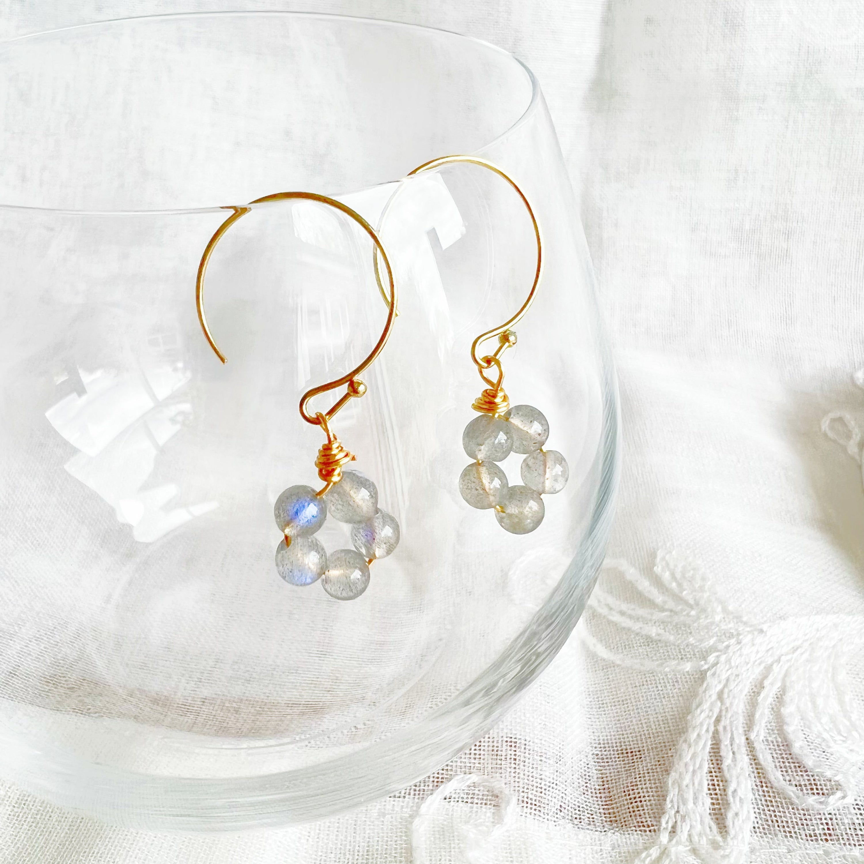 Handmade Moonstone Flower Earrings with sterling silver studs, showcasing natural moonstones with unique imperfections.