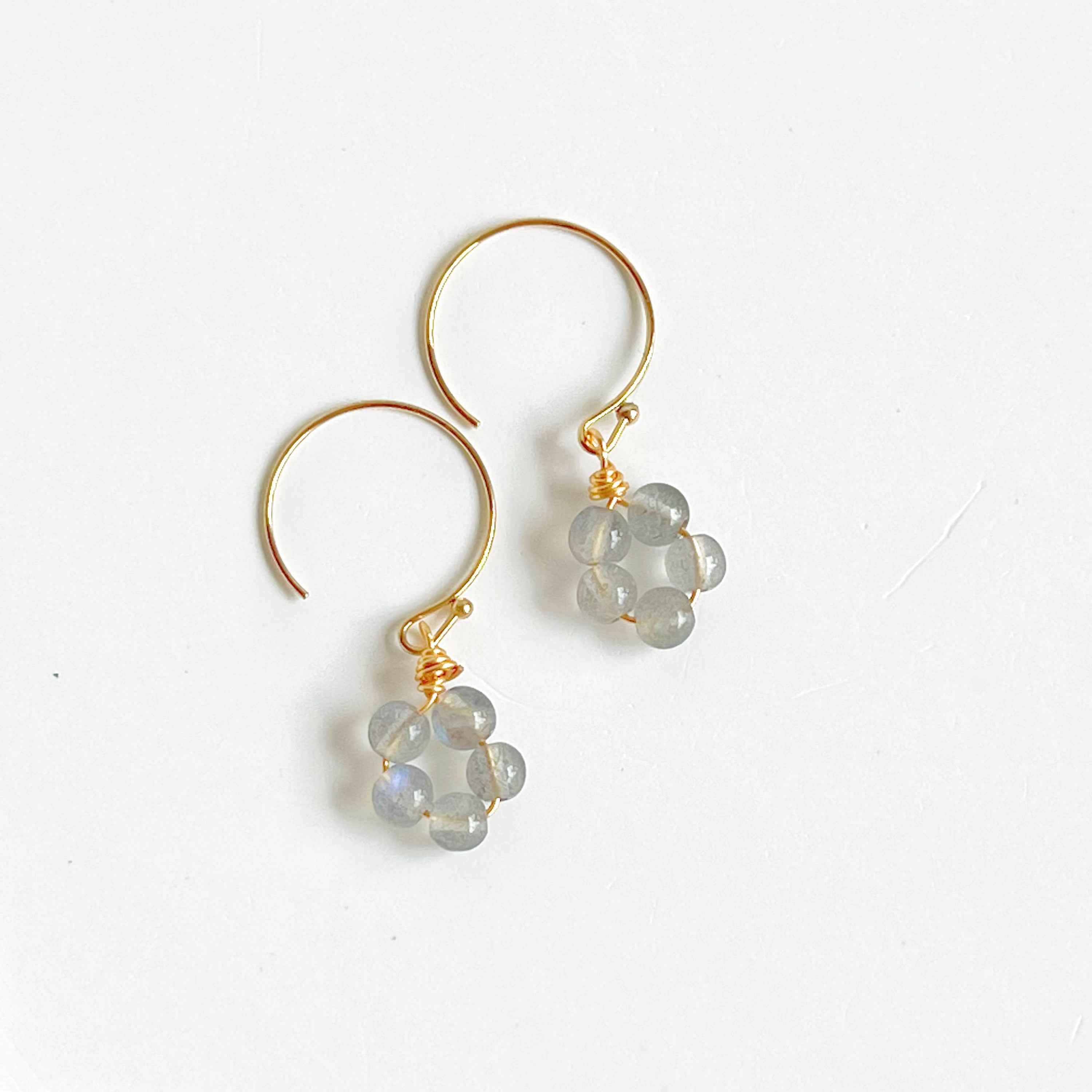 Handmade Moonstone Flower Earrings with sterling silver studs, showcasing natural moonstones with unique imperfections.