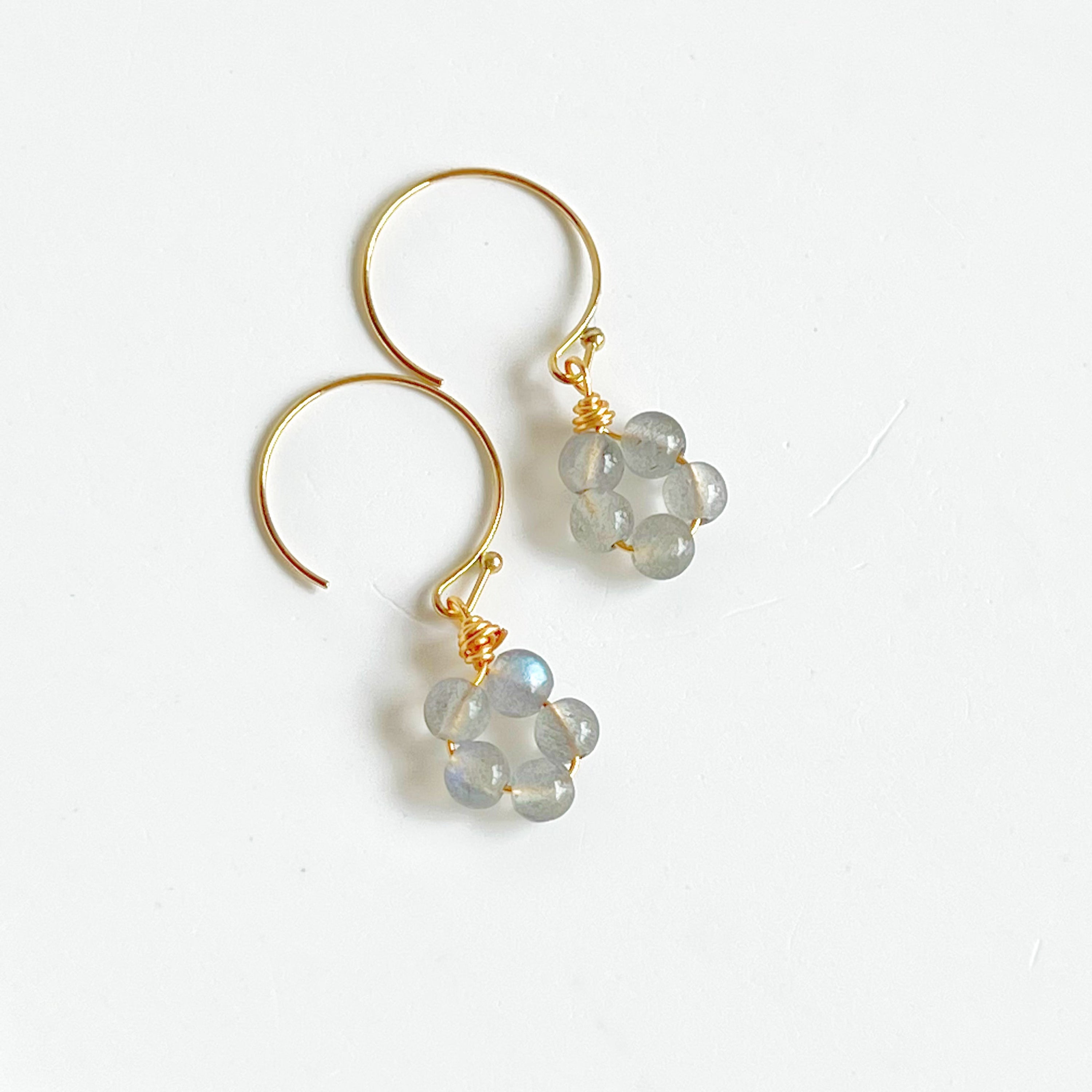 Handmade Moonstone Flower Earrings with sterling silver studs, showcasing natural moonstones with unique imperfections.