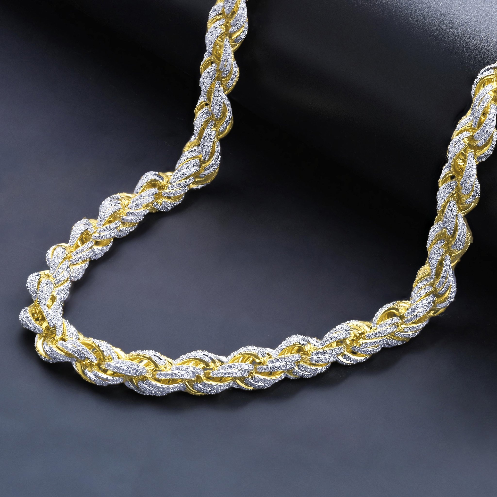 Montage CZ Chain necklace featuring a twisty design with AAA Cubic Zirconia set in brass, available in rhodium and gold plating.