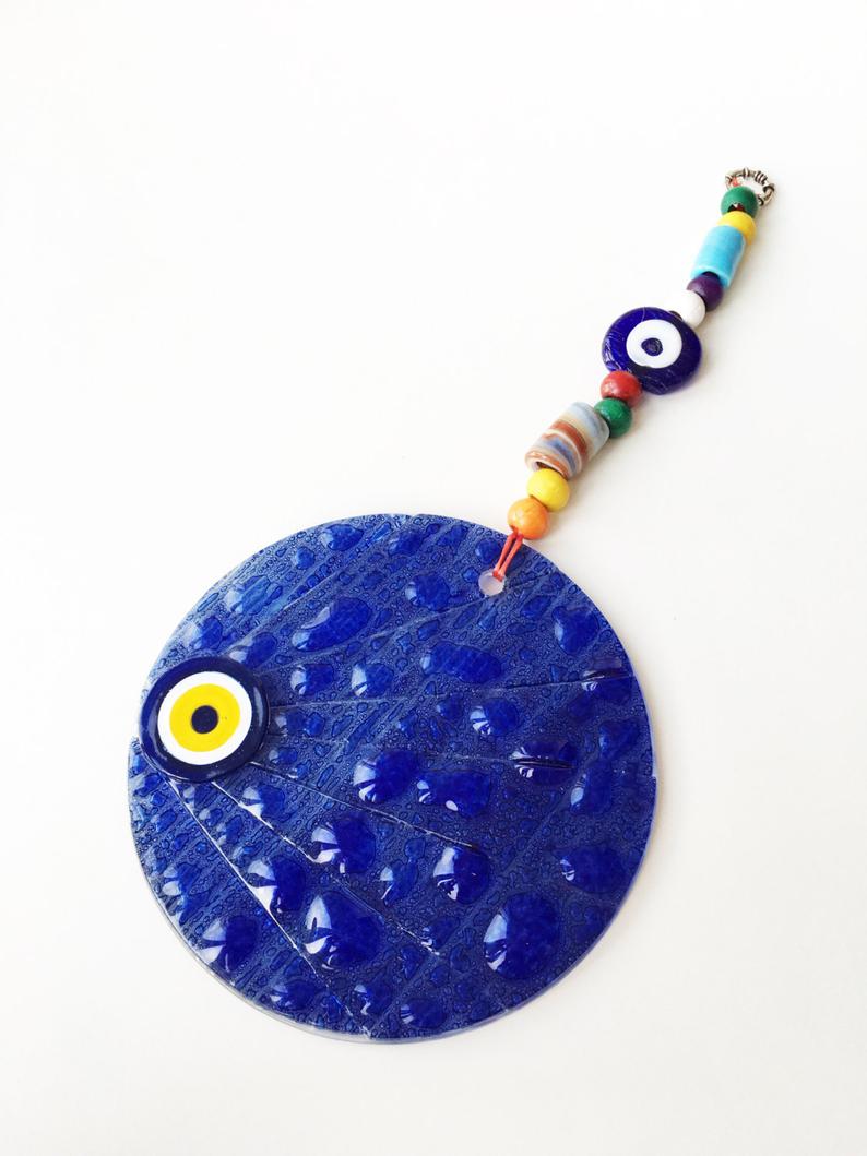 Handmade mosaic glass evil eye wall hanging, featuring vibrant colors and intricate designs, measuring 12cm x 12cm.