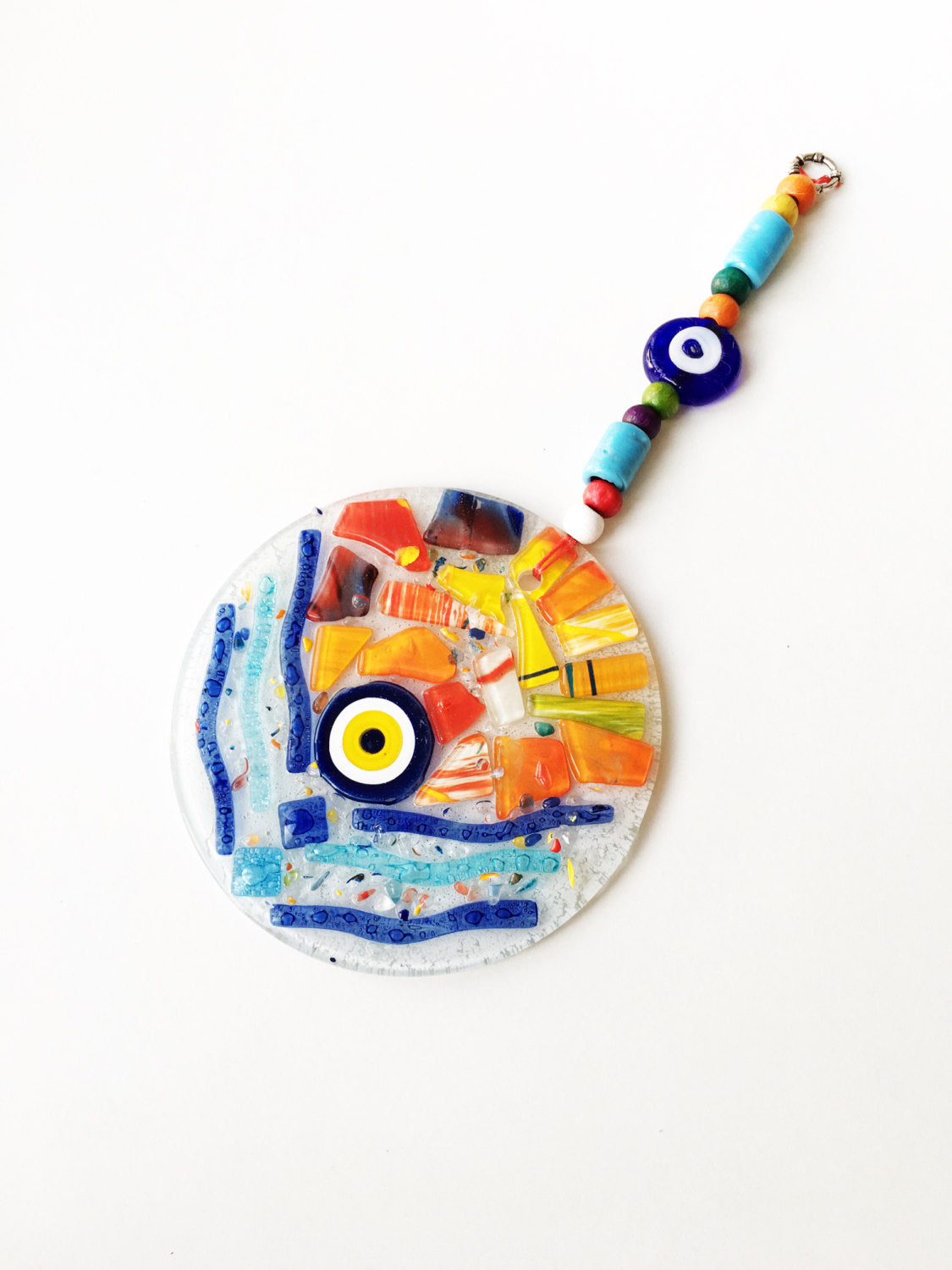 A vibrant Mosaic Glass Evil Eye Wall Hanging featuring intricate designs and colors, perfect for home decor and protection.