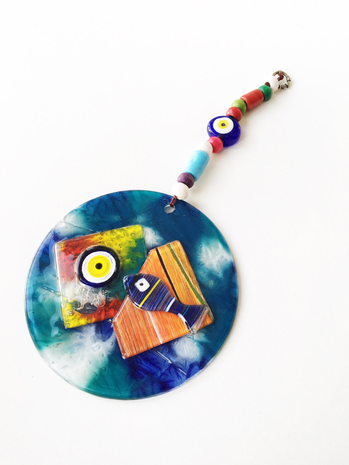 Handmade Mosaic Glass Evil Eye Wall Hanging featuring a vibrant fish design, symbolizing protection and good luck.