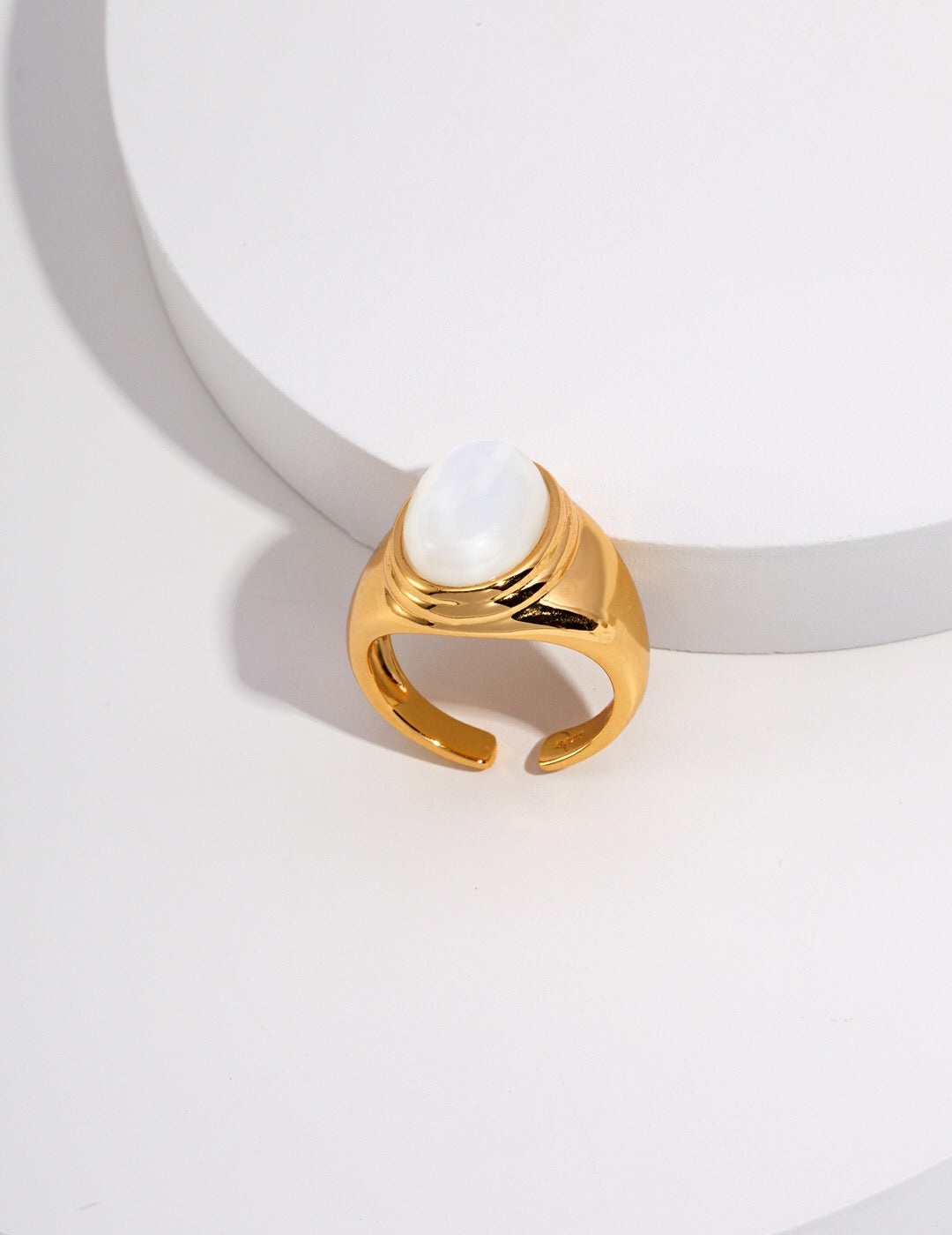 Elegant Mother Of Pearl and Black Onyx Adjustable Ring showcasing a beautiful oval gemstone design, set in gold vermeil.