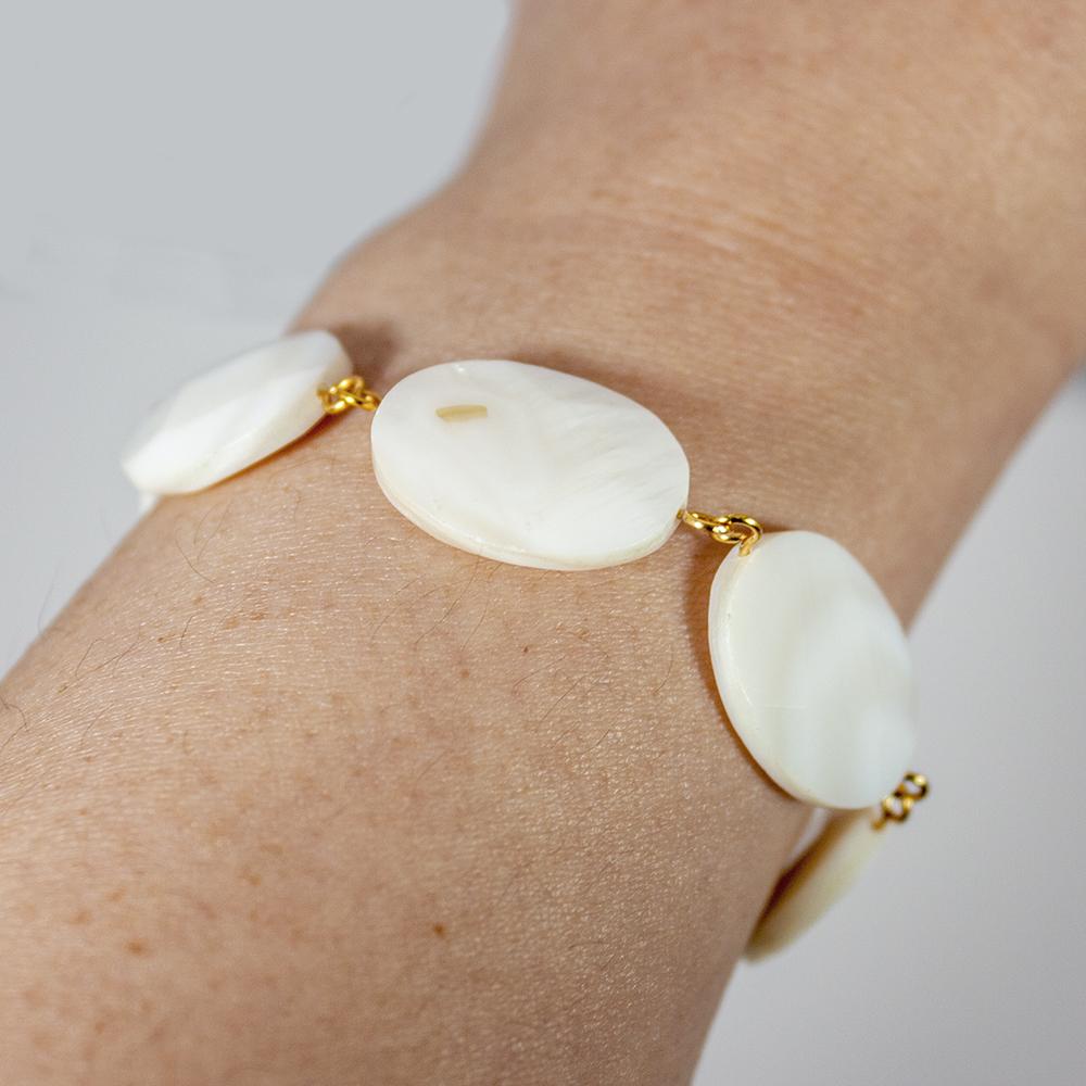 Elegant Mother of Pearl Oval Chain Bracelet featuring natural oval beads and silver-plated copper closure.