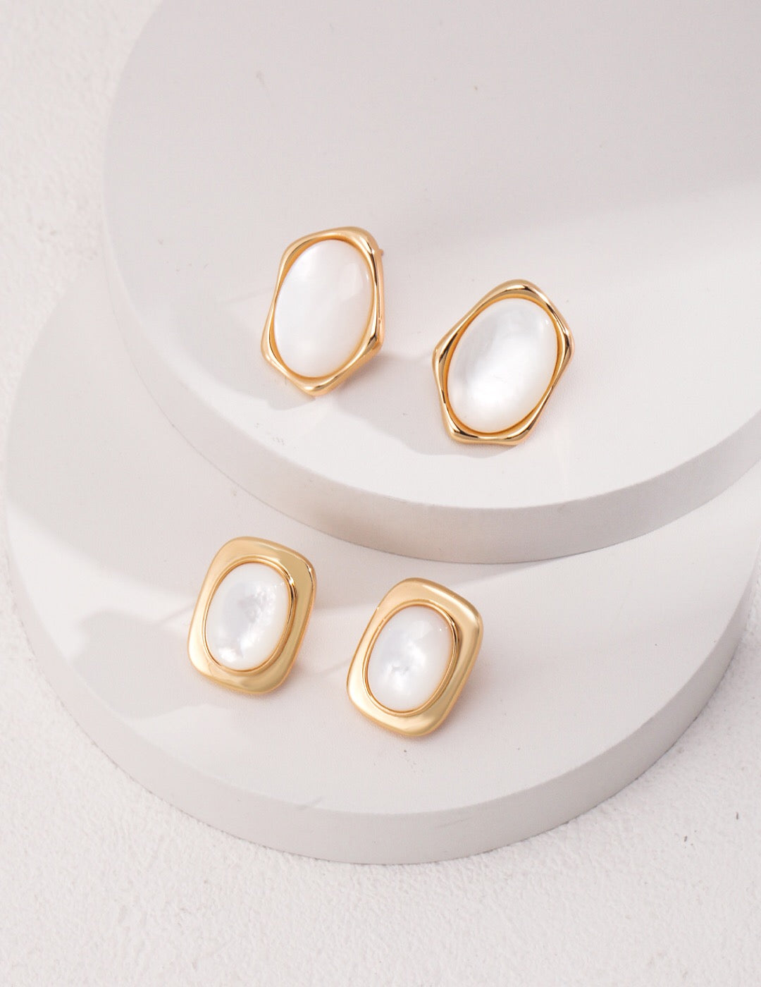 Elegant Mother Of Pearl Stud Earrings with gold vermeil finish, showcasing their unique handmade design.