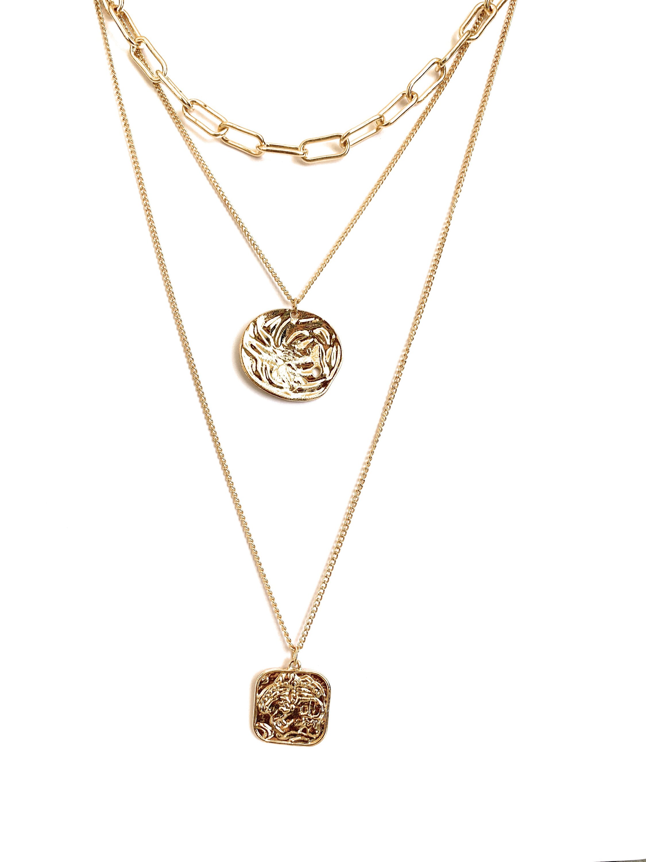 Multi layered necklace featuring coin and square pendants, elegantly designed with 14k gold plating.