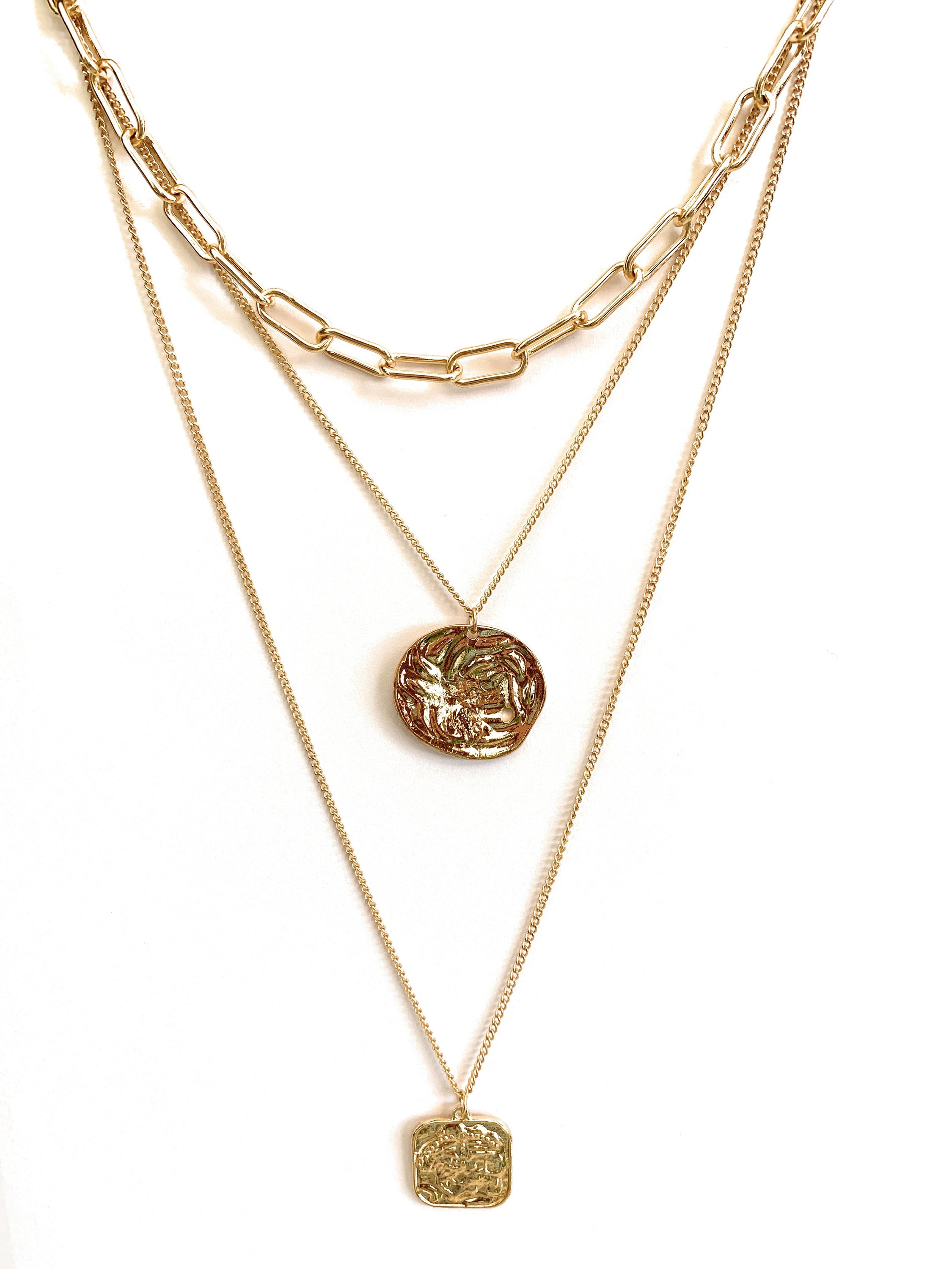 Multi layered necklace featuring coin and square pendants, elegantly designed with 14k gold plating.