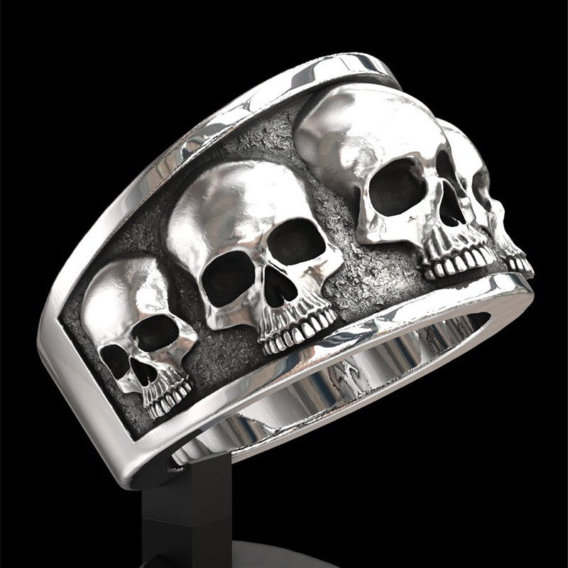 Multi Skull Ring made of durable alloy featuring multiple intricately designed skulls.