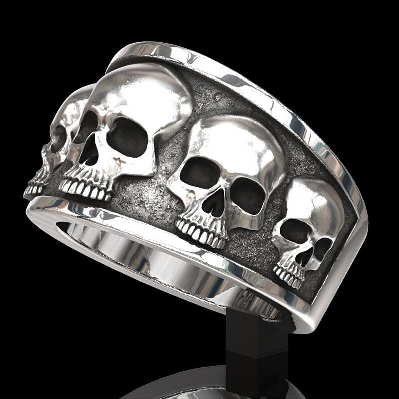 Multi Skull Ring made of durable alloy featuring multiple intricately designed skulls.