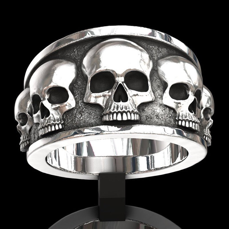 Multi Skull Ring made of durable alloy featuring multiple intricately designed skulls.