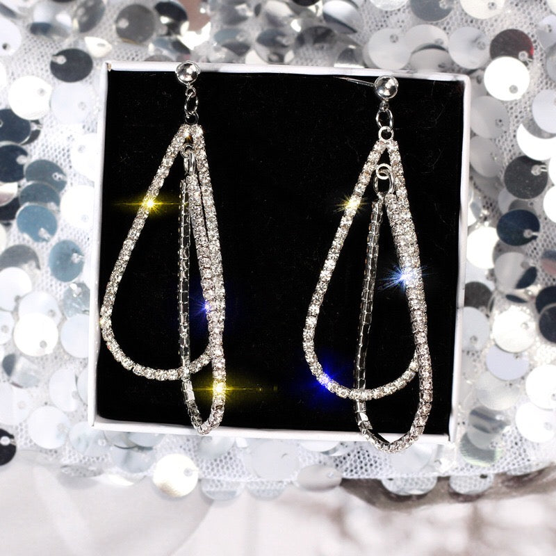 Elegant Multi Water Drop Earrings featuring alloy, rhinestone, and S925 silver, showcasing a cascading drop design.